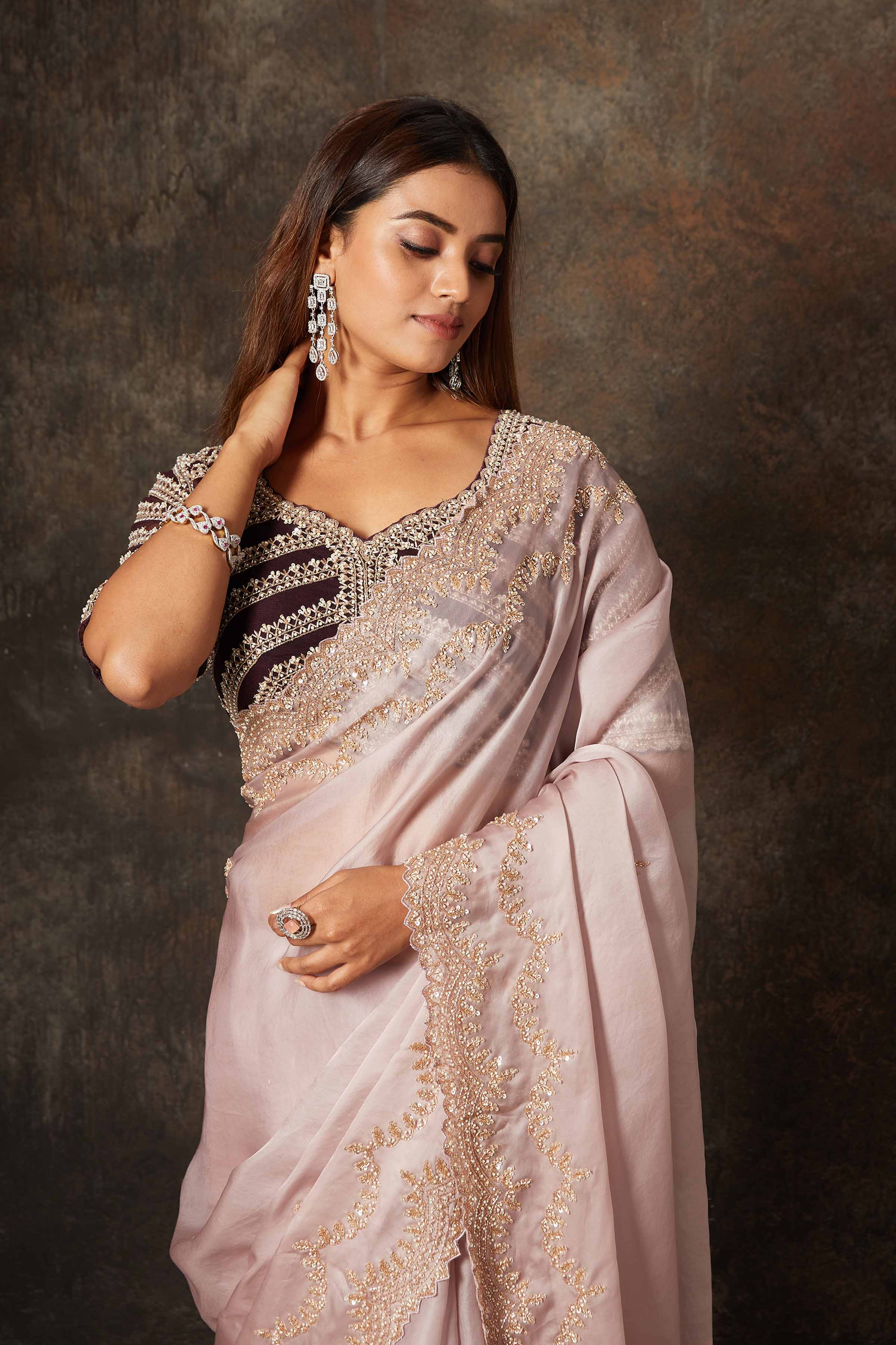 Buy beautiful lilac hand embroidered organza saree online in USA with heavy embroidery blouse. Flaunt your Indian style on special occasions in beautiful designer sarees, embroidered sarees, Bollywood sarees, partywear sarees, wedding sarees from Pure Elegance Indian saree store in USA. -closeup
