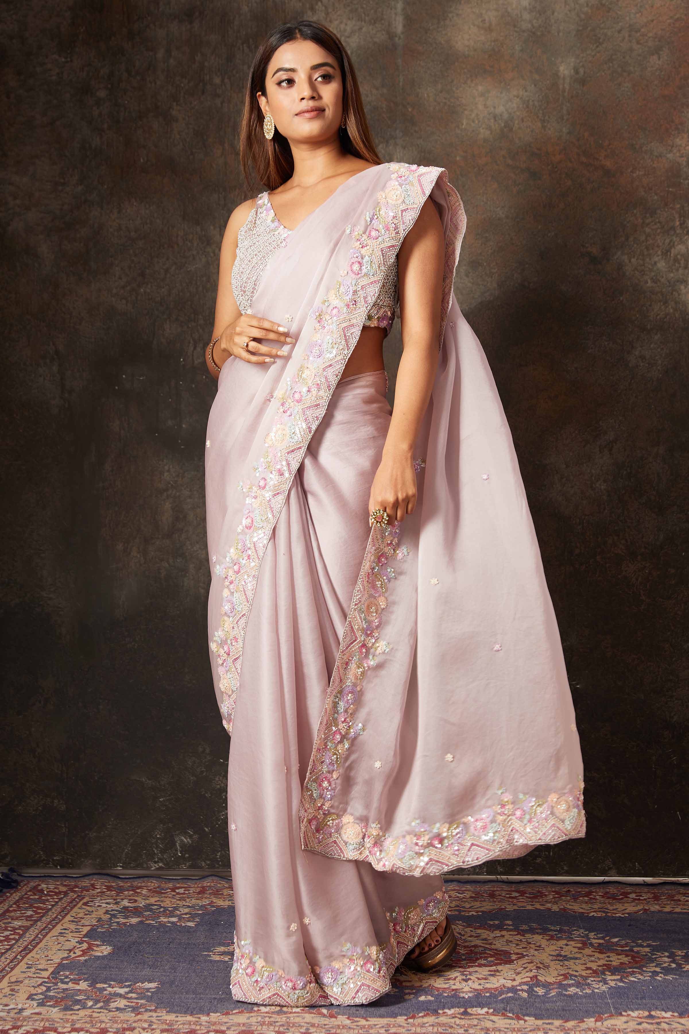 Buy powder pink embroidered organza saree online in USA with blouse. Flaunt your Indian style on special occasions in beautiful designer sarees, embroidered sarees, Bollywood sarees, partywear sarees, wedding sarees from Pure Elegance Indian saree store in USA. -pallu