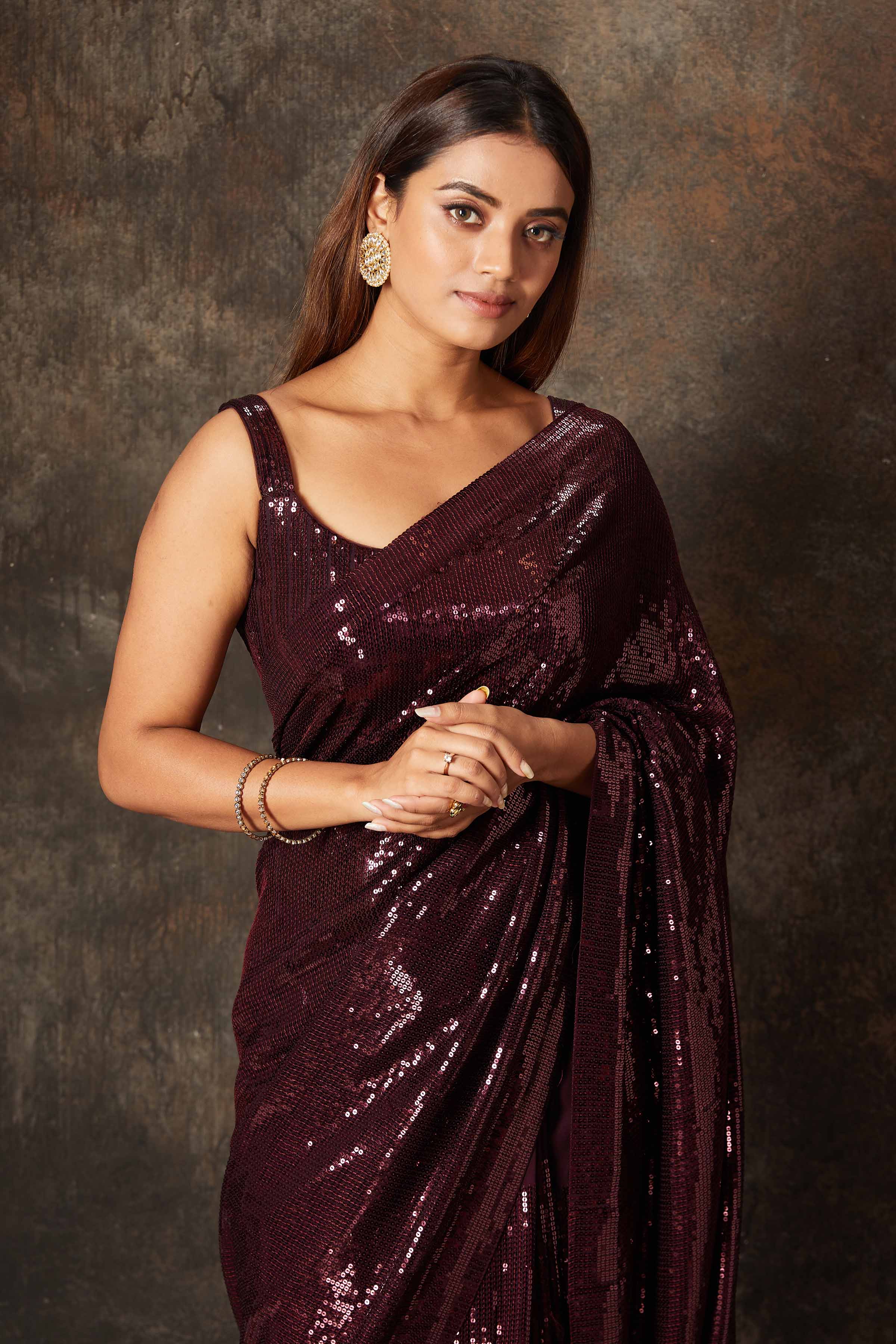 Buy beautiful wine color georgette saree online in USA with blouse. Flaunt your Indian style on special occasions in beautiful designer sarees, embroidered sarees, Bollywood sarees, partywear sarees, wedding sarees from Pure Elegance Indian saree store in USA. -closeup