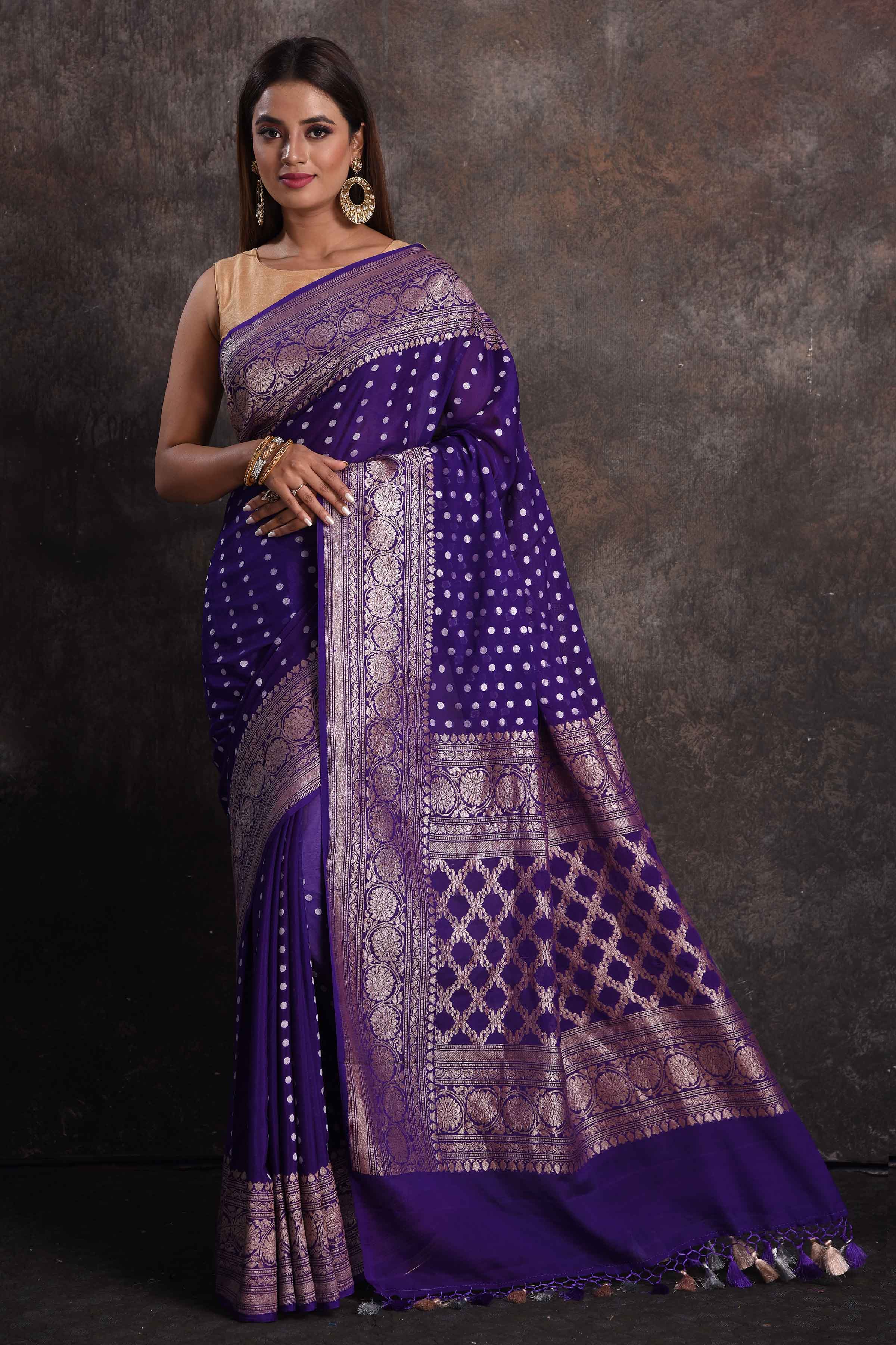 Shop stunning purple georgette Banarasi saree online in USA with silver zari border, Be a vision of ethnic elegance on festive occasions in beautiful designer sarees, silk sarees, handloom sarees, Kanchipuram silk sarees, embroidered sarees from Pure Elegance Indian saree store in USA. -full view