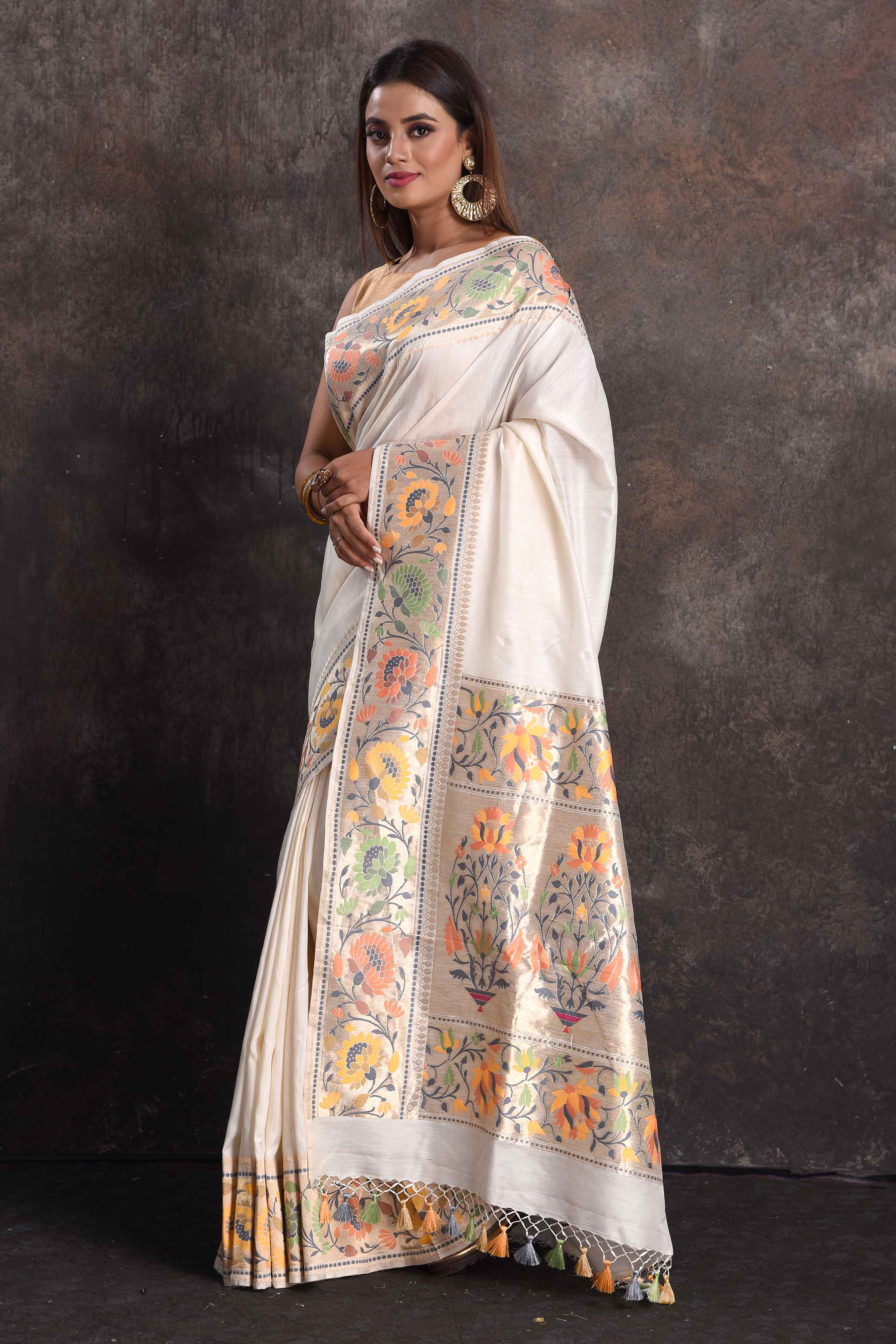 Shop cream muga silk saree online in USA with floral border, Be a vision of ethnic elegance on festive occasions in beautiful designer sarees, silk sarees, handloom sarees, Kanchipuram silk sarees, embroidered sarees from Pure Elegance Indian saree store in USA. -pallu