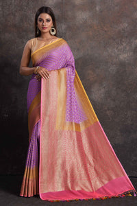 Buy beautiful lavender georgette Banarasi saree online in USA with pink and yellow border, Be a vision of ethnic elegance on festive occasions in beautiful designer sarees, silk sarees, handloom sarees, Kanchipuram silk sarees, embroidered sarees from Pure Elegance Indian saree store in USA. -full view