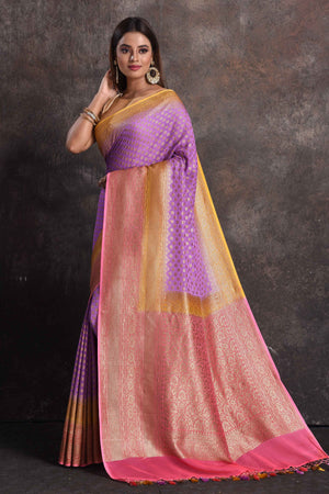 Buy beautiful lavender georgette Banarasi saree online in USA with pink and yellow border, Be a vision of ethnic elegance on festive occasions in beautiful designer sarees, silk sarees, handloom sarees, Kanchipuram silk sarees, embroidered sarees from Pure Elegance Indian saree store in USA. -pallu