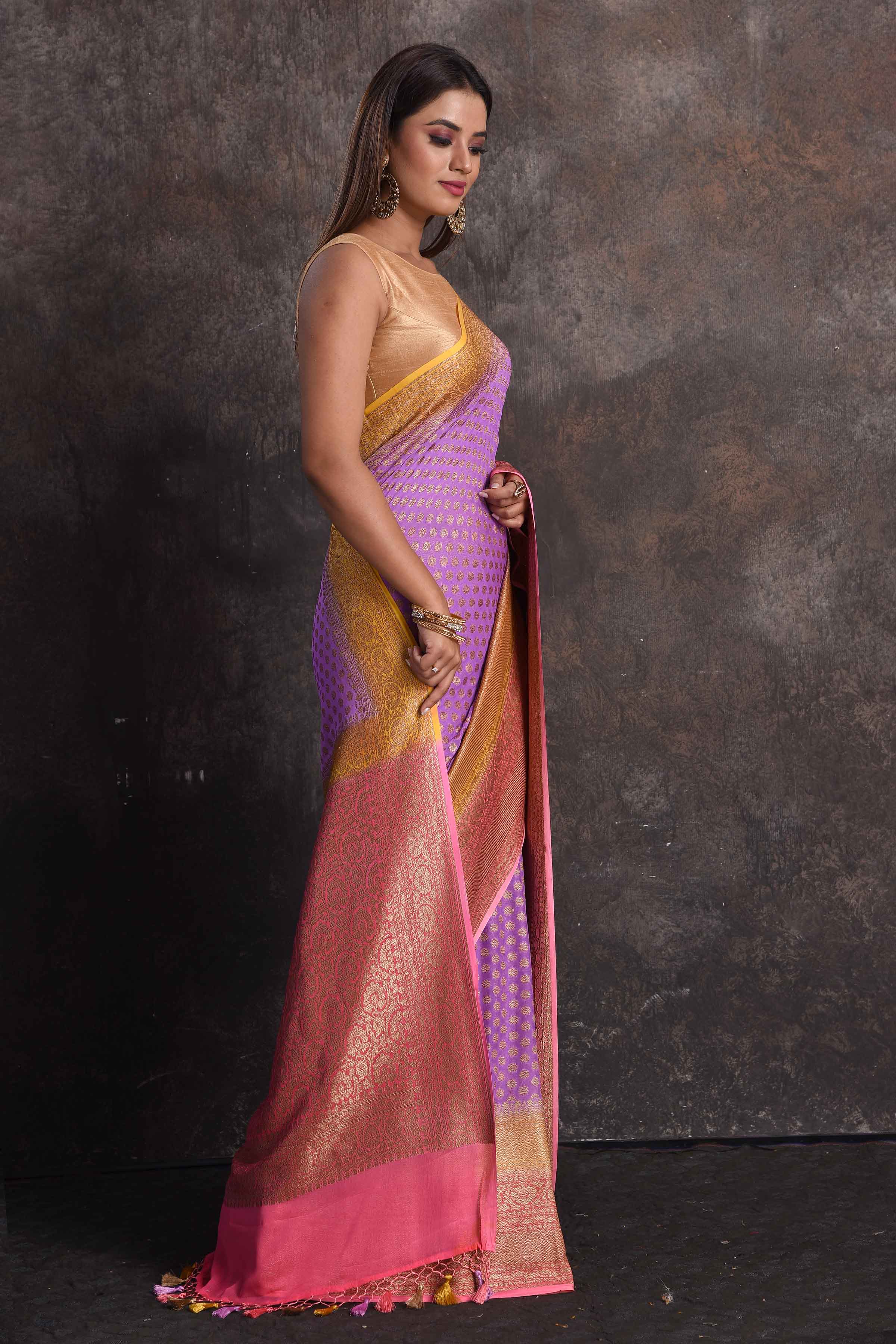 Buy beautiful lavender georgette Banarasi saree online in USA with pink and yellow border, Be a vision of ethnic elegance on festive occasions in beautiful designer sarees, silk sarees, handloom sarees, Kanchipuram silk sarees, embroidered sarees from Pure Elegance Indian saree store in USA. -right
