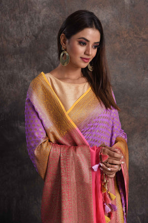 Buy beautiful lavender georgette Banarasi saree online in USA with pink and yellow border, Be a vision of ethnic elegance on festive occasions in beautiful designer sarees, silk sarees, handloom sarees, Kanchipuram silk sarees, embroidered sarees from Pure Elegance Indian saree store in USA. -closeup