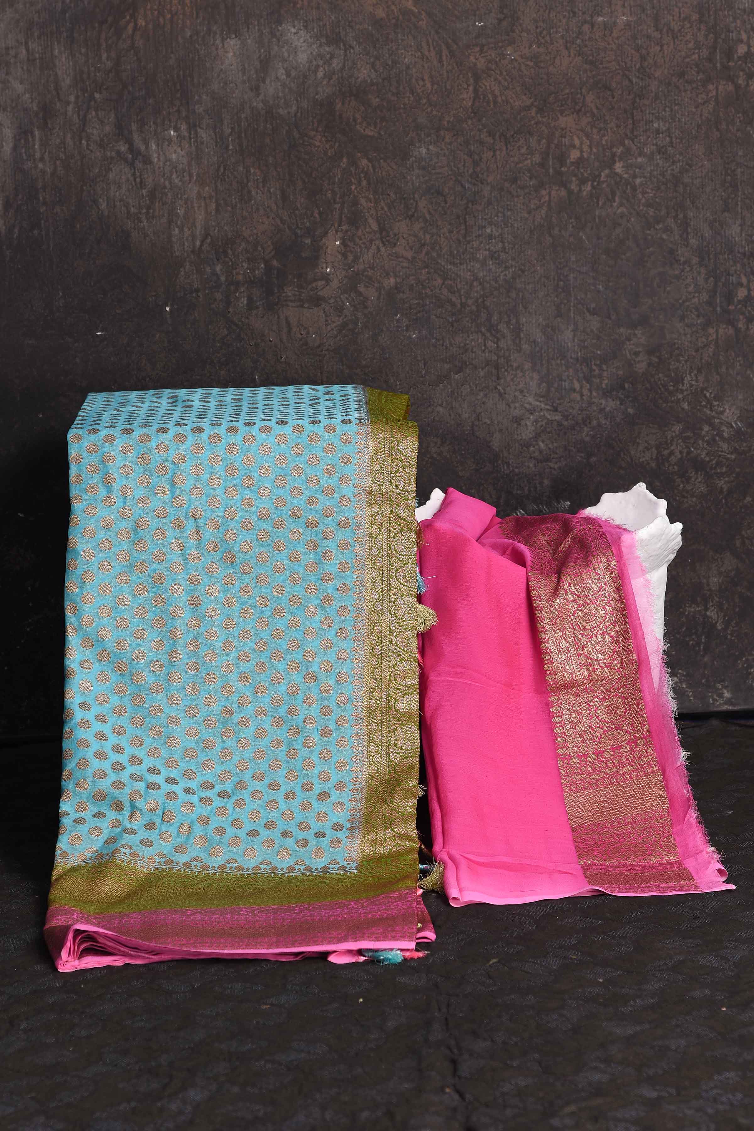 Buy beautiful sky blue georgette Banarasi saree online in USA with pink and green border, Be a vision of ethnic elegance on festive occasions in beautiful designer sarees, silk sarees, handloom sarees, Kanchipuram silk sarees, embroidered sarees from Pure Elegance Indian saree store in USA. -blouse