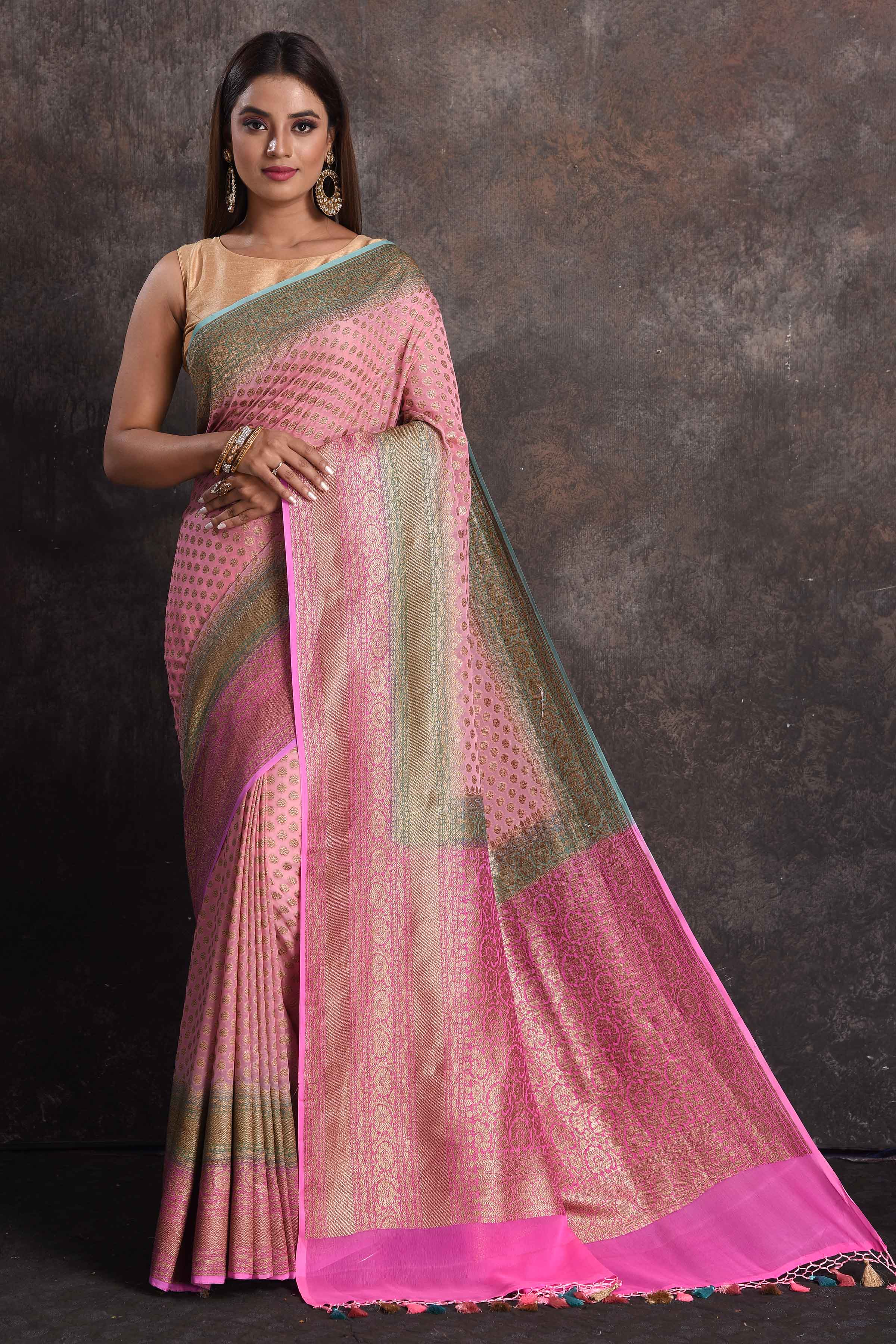 Shop light pink georgette Banarasi saree online in USA with blue border, Be a vision of ethnic elegance on festive occasions in beautiful designer sarees, silk sarees, handloom sarees, Kanchipuram silk sarees, embroidered sarees from Pure Elegance Indian saree store in USA. -full view