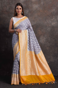 Shop beautiful grey georgette Banarasi saree online in USA with yellow border, Be a vision of ethnic elegance on festive occasions in beautiful designer sarees, silk sarees, handloom sarees, Kanchipuram silk sarees, embroidered sarees from Pure Elegance Indian saree store in USA. -full view