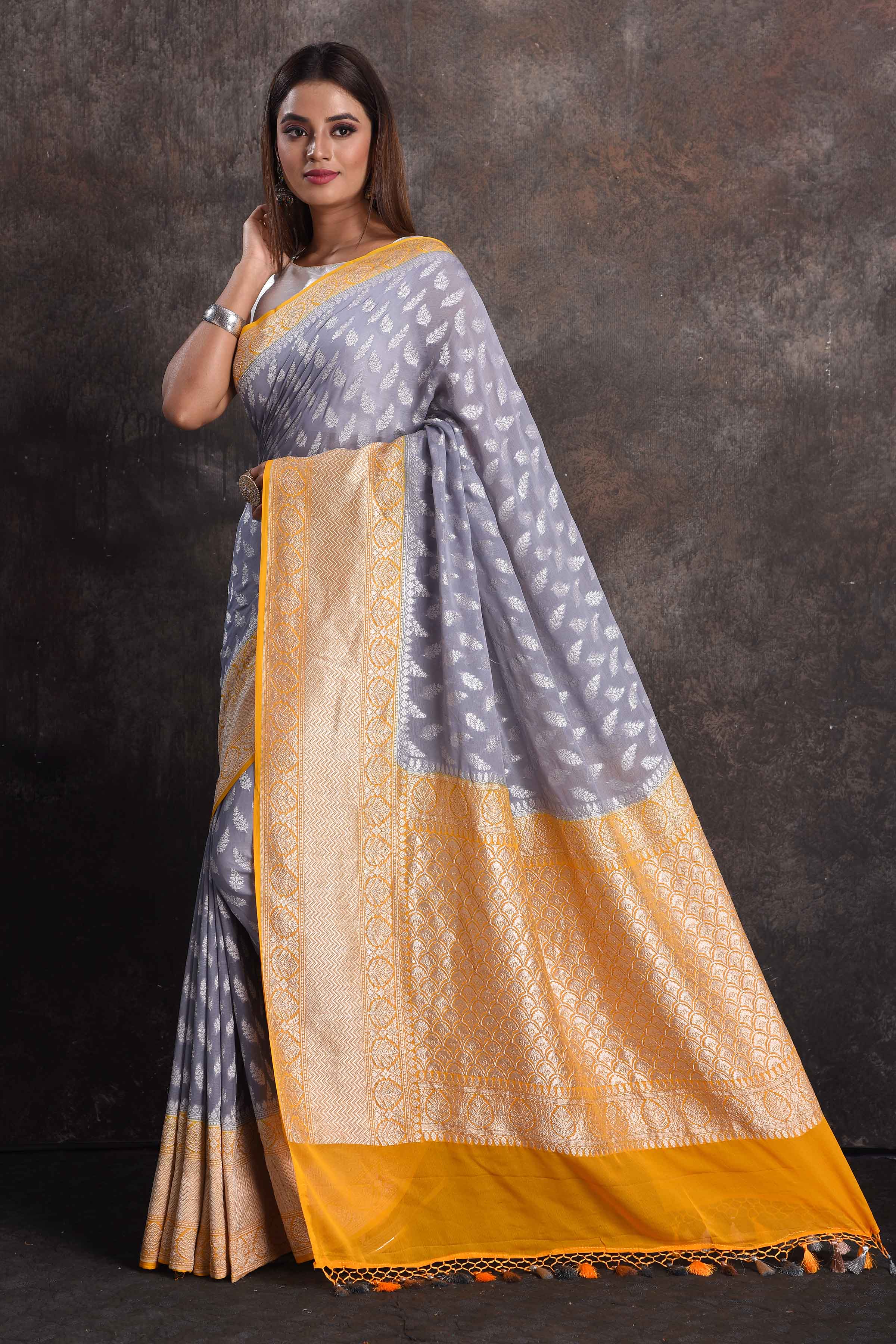 Shop beautiful grey georgette Banarasi saree online in USA with yellow border, Be a vision of ethnic elegance on festive occasions in beautiful designer sarees, silk sarees, handloom sarees, Kanchipuram silk sarees, embroidered sarees from Pure Elegance Indian saree store in USA. -pallu