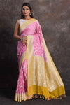 Buy beautiful pastel pink georgette Banarasi saree online in USA with mustard border, Be a vision of ethnic elegance on festive occasions in beautiful designer sarees, silk sarees, handloom sarees, Kanchipuram silk sarees, embroidered sarees from Pure Elegance Indian saree store in USA. -full view
