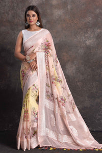 Shop beautiful powder pink yellow floral georgette saree online in USA with zari border, Be a vision of ethnic elegance on festive occasions in beautiful designer sarees, silk sarees, handloom sarees, Kanchipuram silk sarees, embroidered sarees from Pure Elegance Indian saree store in USA. -full view