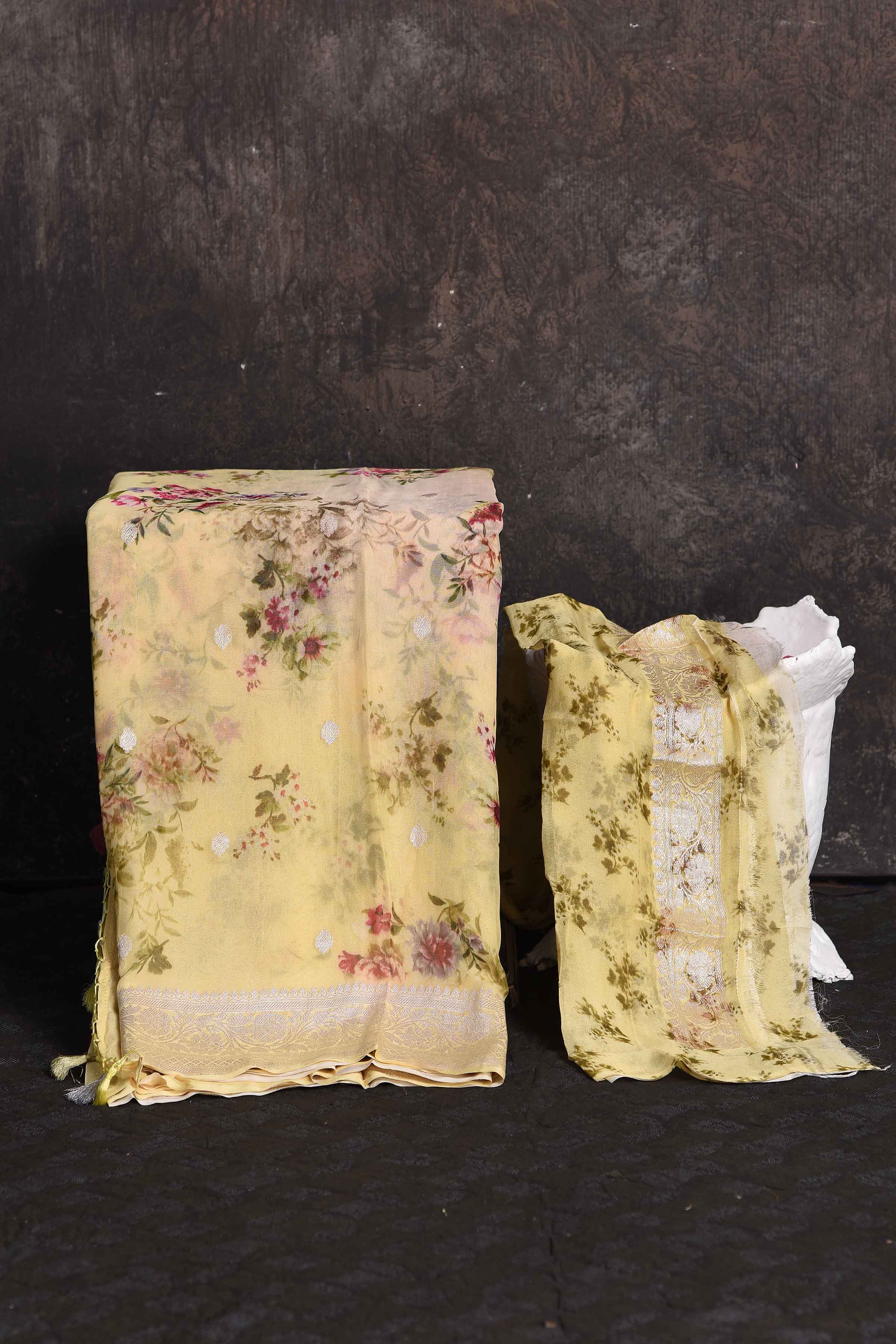 Buy beautiful light yellow floral georgette saree online in USA with zari border, Be a vision of ethnic elegance on festive occasions in beautiful designer sarees, silk sarees, handloom sarees, Kanchipuram silk sarees, embroidered sarees from Pure Elegance Indian saree store in USA. -blouse