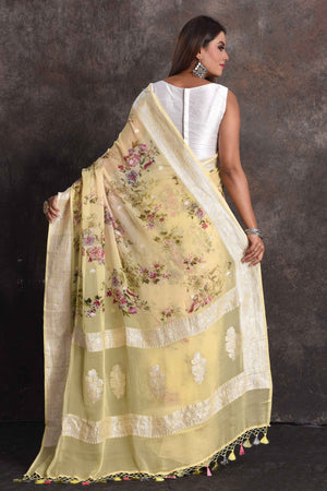 Buy beautiful light yellow floral georgette saree online in USA with zari border, Be a vision of ethnic elegance on festive occasions in beautiful designer sarees, silk sarees, handloom sarees, Kanchipuram silk sarees, embroidered sarees from Pure Elegance Indian saree store in USA. -back