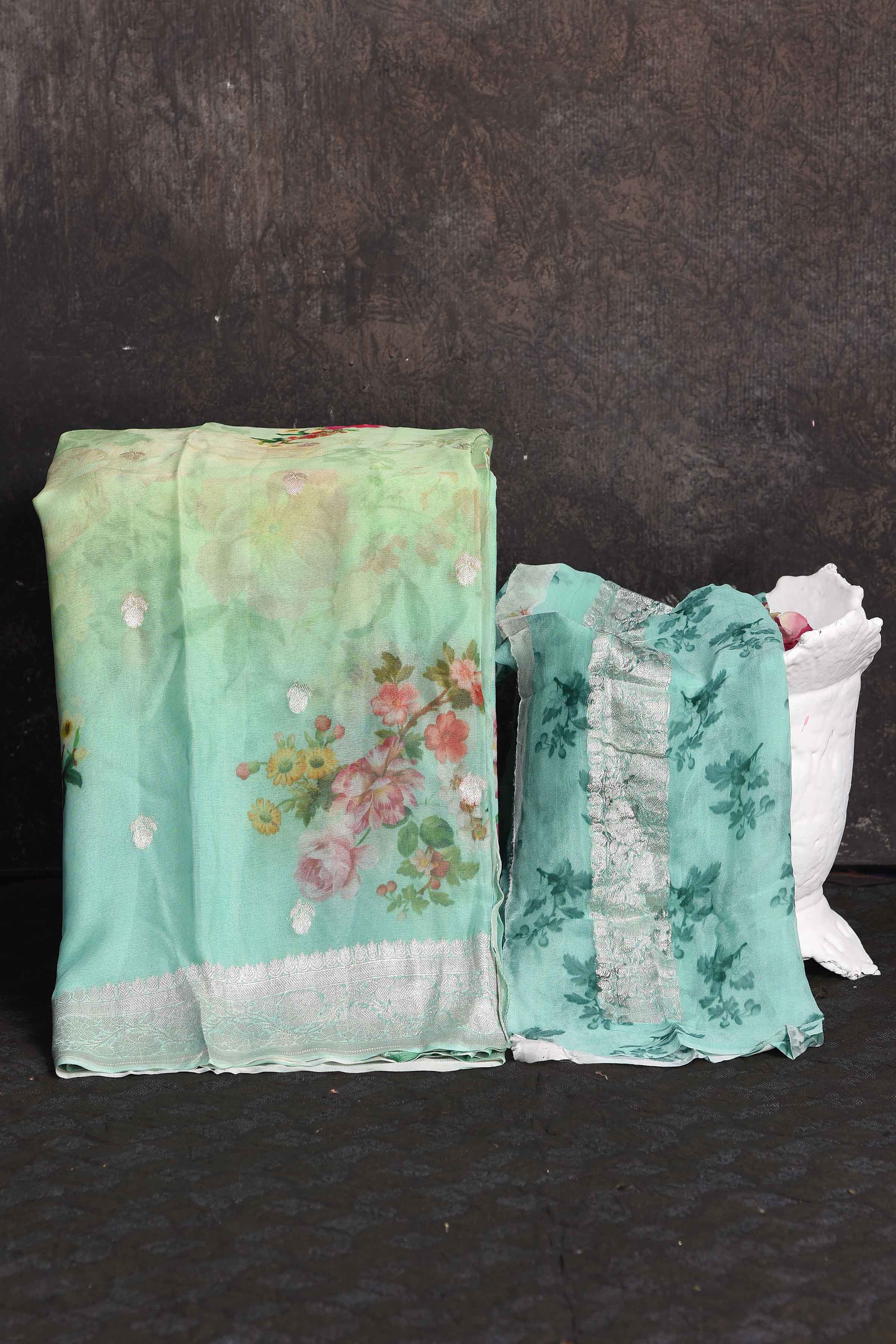 Shop beautiful pastel green floral georgette saree online in USA with zari border, Be a vision of ethnic elegance on festive occasions in beautiful designer sarees, silk sarees, handloom sarees, Kanchipuram silk sarees, embroidered sarees from Pure Elegance Indian saree store in USA. -blouse
