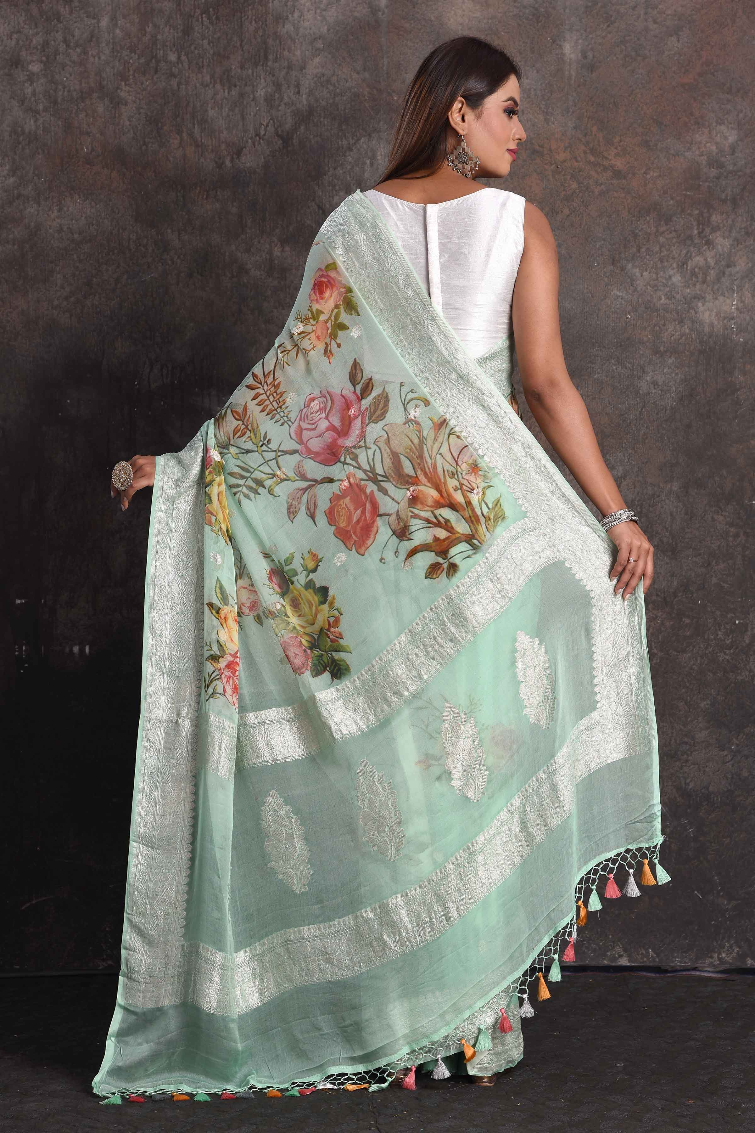 Shop beautiful pastel green floral georgette saree online in USA with zari border, Be a vision of ethnic elegance on festive occasions in beautiful designer sarees, silk sarees, handloom sarees, Kanchipuram silk sarees, embroidered sarees from Pure Elegance Indian saree store in USA. -back