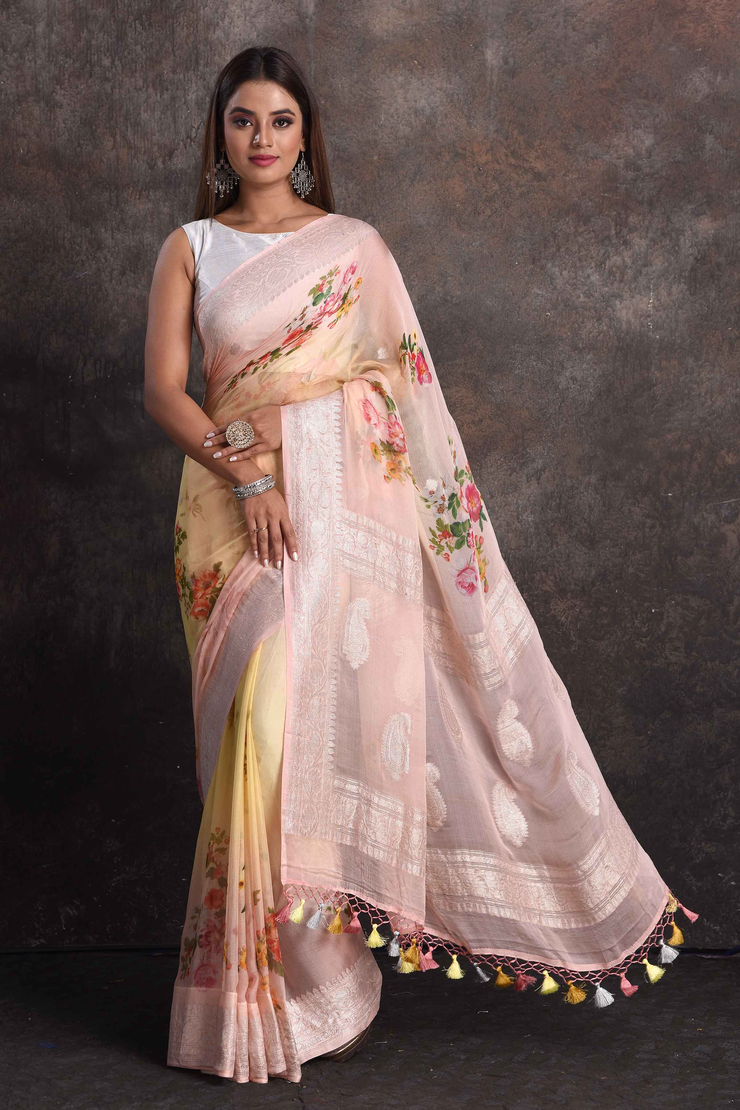 Buy beautiful yellow peach floral georgette saree online in USA with zari border, Be a vision of ethnic elegance on festive occasions in beautiful designer sarees, silk sarees, handloom sarees, Kanchipuram silk sarees, embroidered sarees from Pure Elegance Indian saree store in USA. -full view