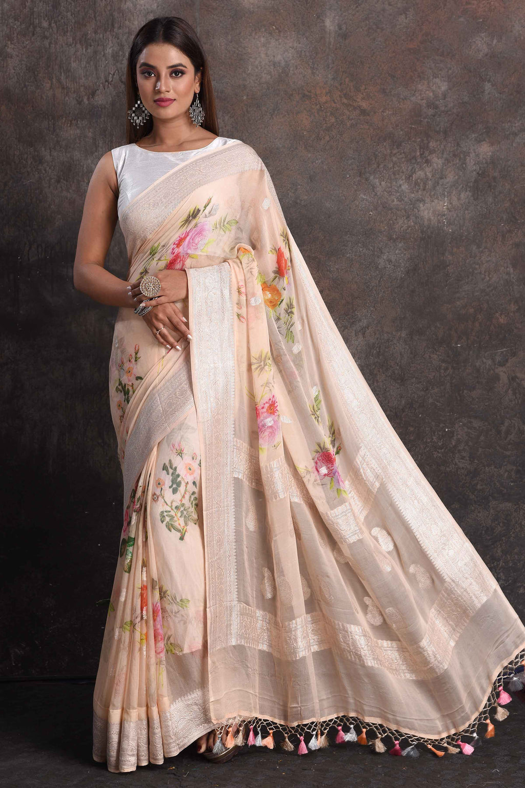 Buy stunning cream floral georgette saree online in USA with zari border, Be a vision of ethnic elegance on festive occasions in beautiful designer sarees, silk sarees, handloom sarees, Kanchipuram silk sarees, embroidered sarees from Pure Elegance Indian saree store in USA. -full view