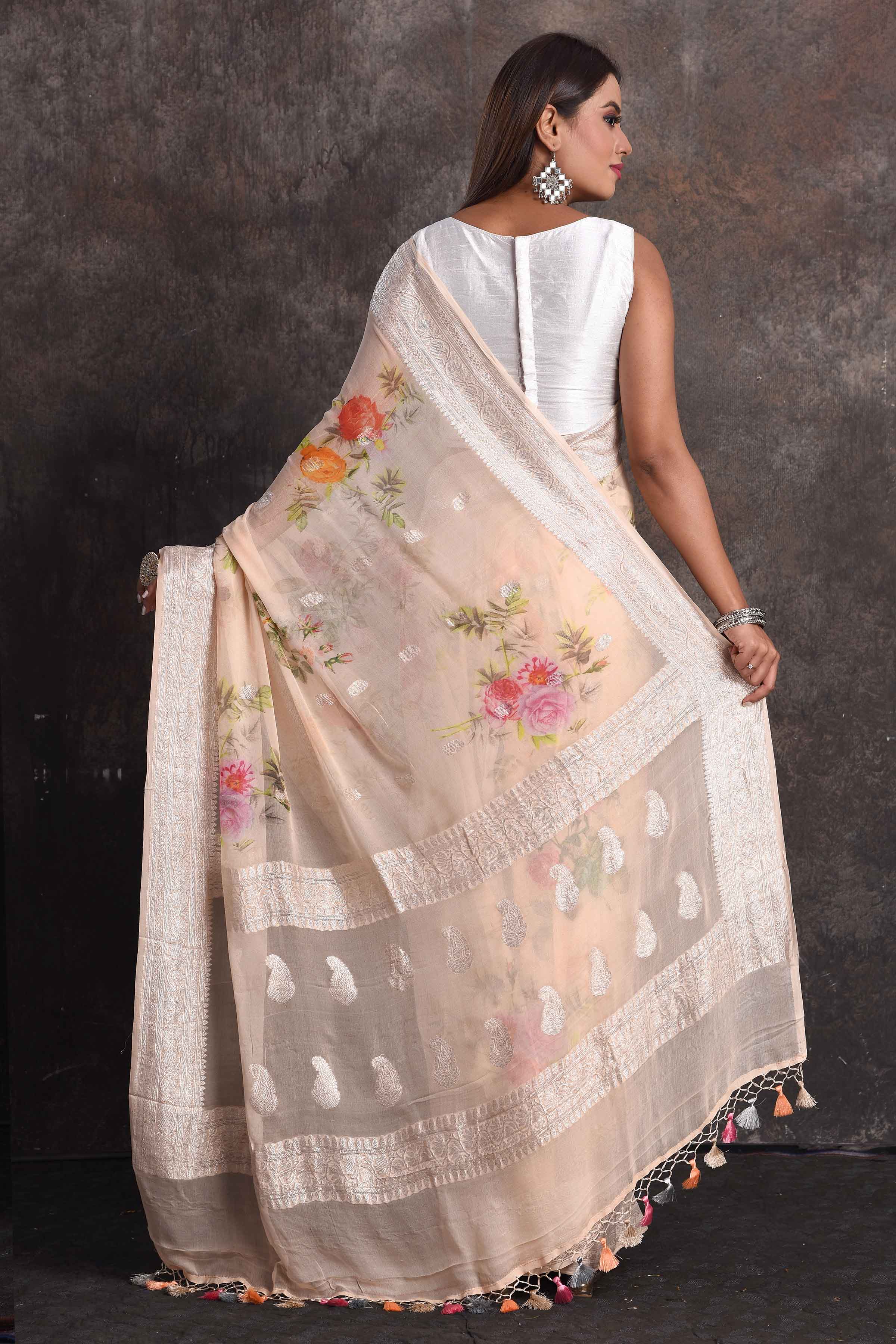 Buy stunning cream floral georgette saree online in USA with zari border, Be a vision of ethnic elegance on festive occasions in beautiful designer sarees, silk sarees, handloom sarees, Kanchipuram silk sarees, embroidered sarees from Pure Elegance Indian saree store in USA. -back