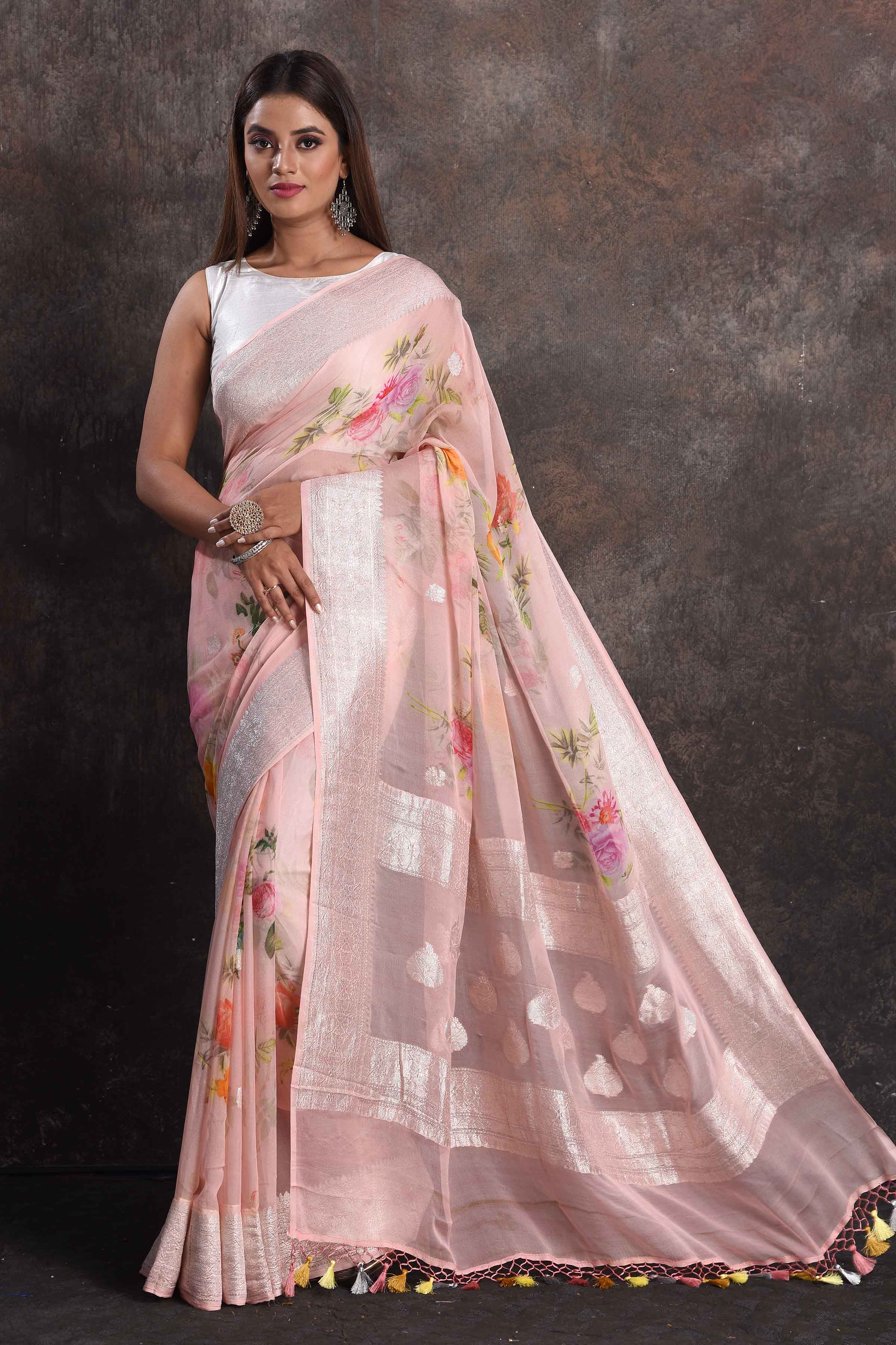 Shop beautiful powder pink floral print georgette saree online in USA with zari border, Be a vision of ethnic elegance on festive occasions in beautiful designer sarees, silk sarees, handloom sarees, Kanchipuram silk sarees, embroidered sarees from Pure Elegance Indian saree store in USA. -full view