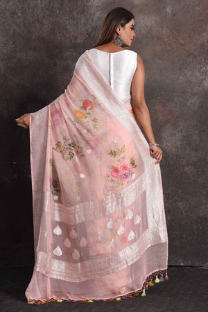 Shop beautiful powder pink floral print georgette saree online in USA with zari border, Be a vision of ethnic elegance on festive occasions in beautiful designer sarees, silk sarees, handloom sarees, Kanchipuram silk sarees, embroidered sarees from Pure Elegance Indian saree store in USA. -back