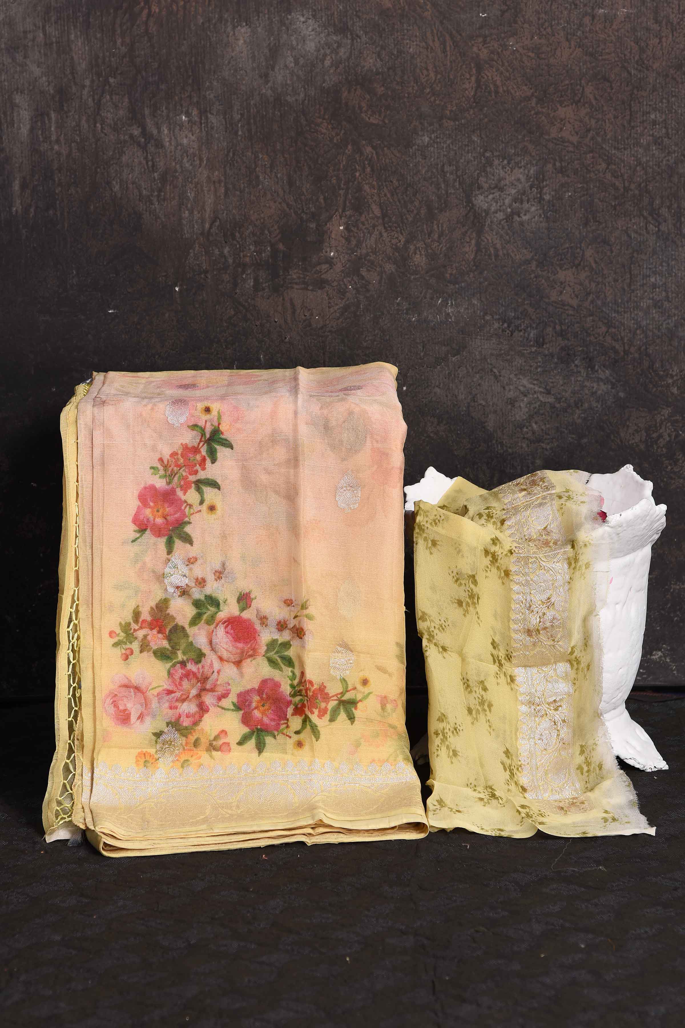 Shop gorgeous peachish yellow floral print georgette saree online in USA with zari border, Be a vision of ethnic elegance on festive occasions in beautiful designer sarees, silk sarees, handloom sarees, Kanchipuram silk sarees, embroidered sarees from Pure Elegance Indian saree store in USA. -blouse