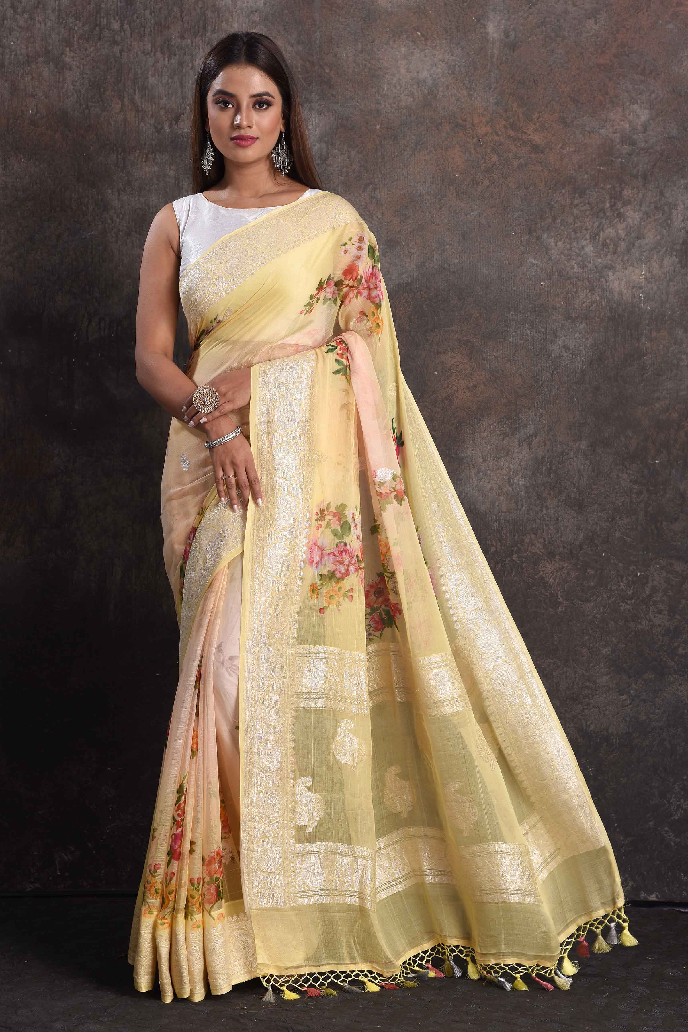 Shop gorgeous peachish yellow floral print georgette saree online in USA with zari border, Be a vision of ethnic elegance on festive occasions in beautiful designer sarees, silk sarees, handloom sarees, Kanchipuram silk sarees, embroidered sarees from Pure Elegance Indian saree store in USA. -full view
