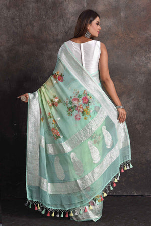 Buy beautiful ombre pastel green floral georgette saree online in USA with zari border, Be a vision of ethnic elegance on festive occasions in beautiful designer sarees, silk sarees, handloom sarees, Kanchipuram silk sarees, embroidered sarees from Pure Elegance Indian saree store in USA. -back