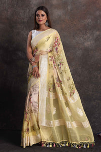 Shop beautiful ombre yellow floral georgette saree online in USA with zari border, Be a vision of ethnic elegance on festive occasions in beautiful designer sarees, silk sarees, handloom sarees, Kanchipuram silk sarees, embroidered sarees from Pure Elegance Indian saree store in USA. -full view