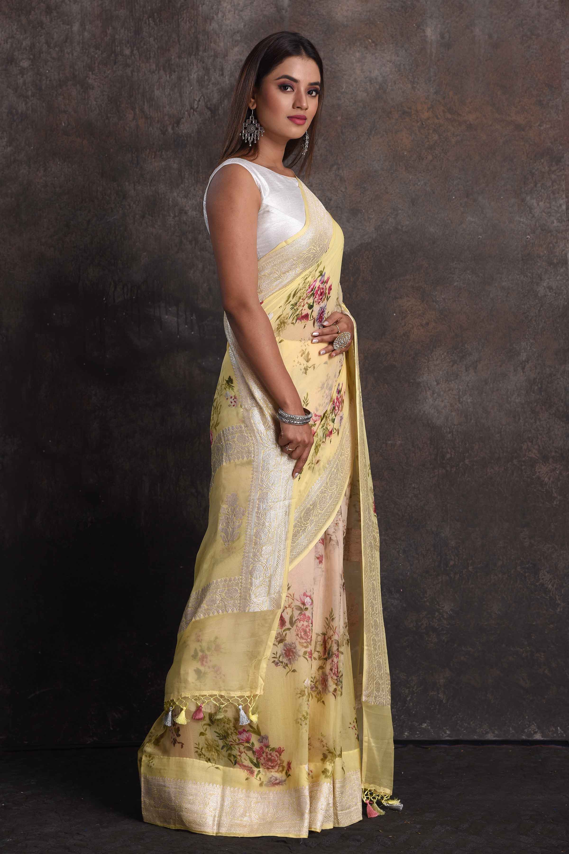 Shop beautiful ombre yellow floral georgette saree online in USA with zari border, Be a vision of ethnic elegance on festive occasions in beautiful designer sarees, silk sarees, handloom sarees, Kanchipuram silk sarees, embroidered sarees from Pure Elegance Indian saree store in USA. -side