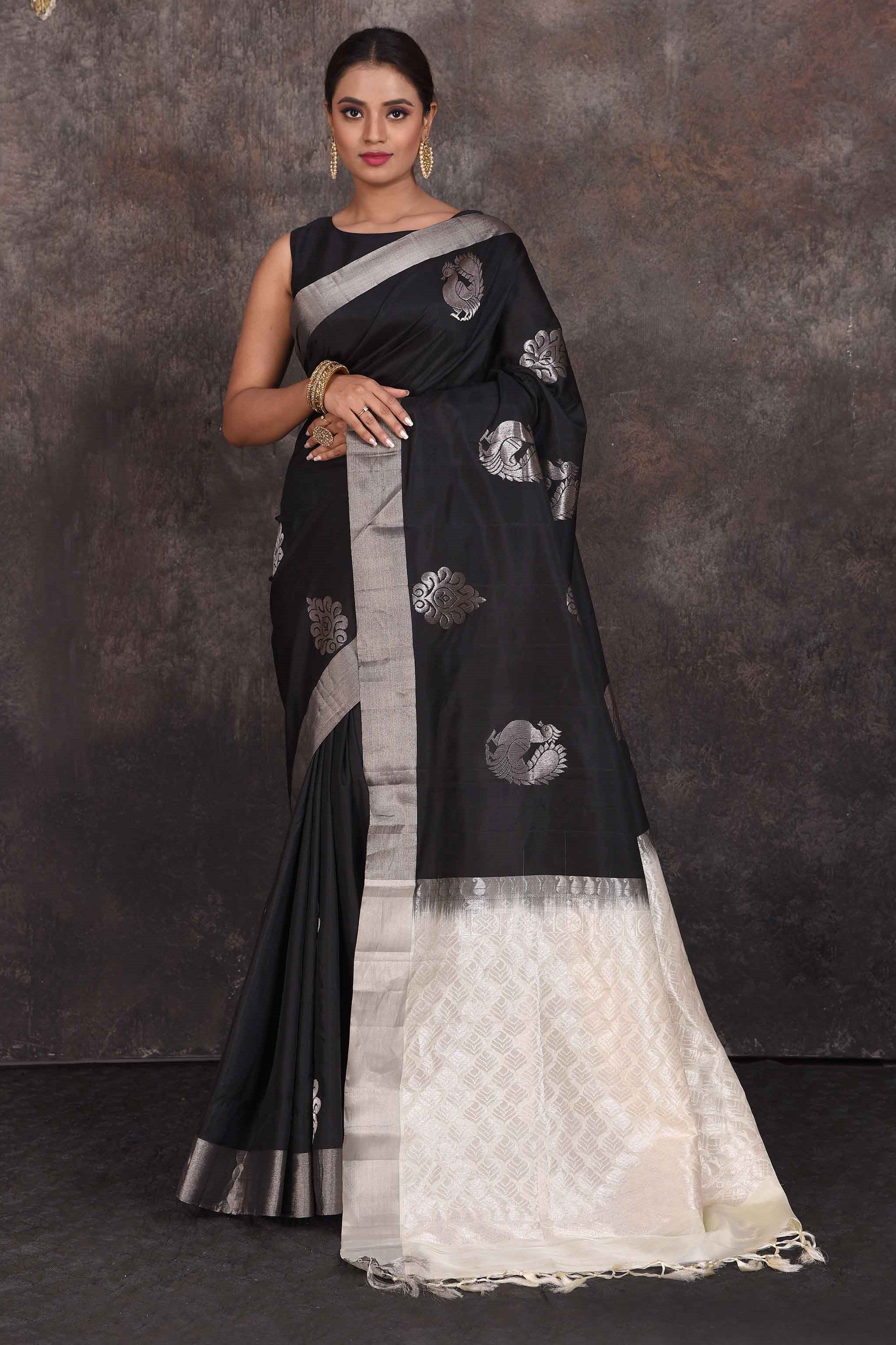 Shop stunning black Kanchipuram silk saree online in USA with silver peacock buta. Look your best at parties in elegant silk sarees, designer sarees, handwoven sarees, Kanchipuram silk sarees, embroidered sarees, South silk sarees from Pure Elegance Indian saree store in USA.-full view