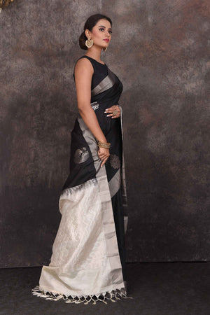 Shop stunning black Kanchipuram silk saree online in USA with silver peacock buta. Look your best at parties in elegant silk sarees, designer sarees, handwoven sarees, Kanchipuram silk sarees, embroidered sarees, South silk sarees from Pure Elegance Indian saree store in USA.-side
