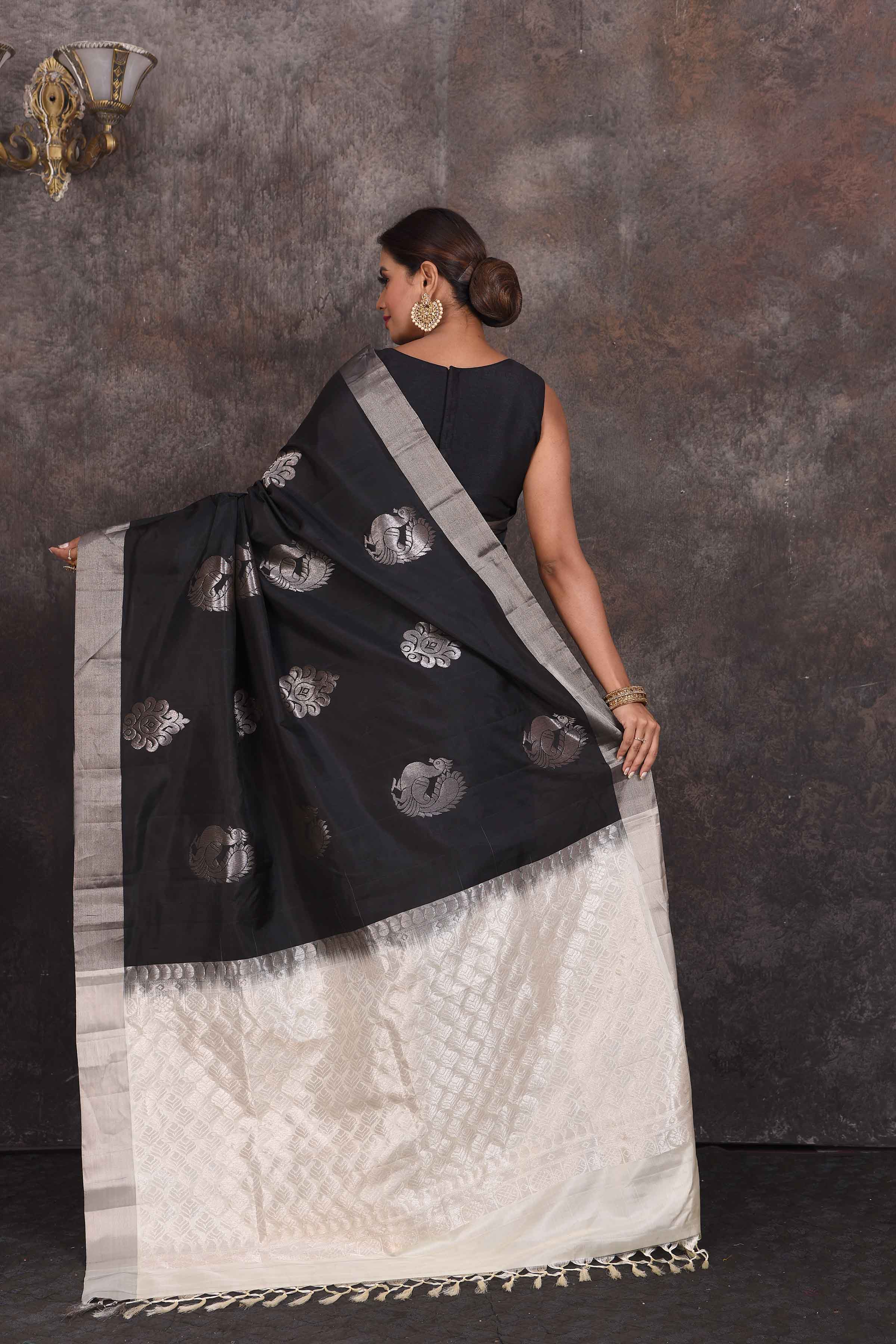 Shop stunning black Kanchipuram silk saree online in USA with silver peacock buta. Look your best at parties in elegant silk sarees, designer sarees, handwoven sarees, Kanchipuram silk sarees, embroidered sarees, South silk sarees from Pure Elegance Indian saree store in USA.-back