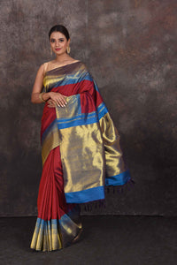 Buy beautiful blood red Kanchipuram silk sari online in USA with blue zari border. Look your best at parties in elegant silk sarees, designer sarees, handwoven sarees, Kanchipuram silk sarees, embroidered sarees, South silk sarees from Pure Elegance Indian saree store in USA.-full view