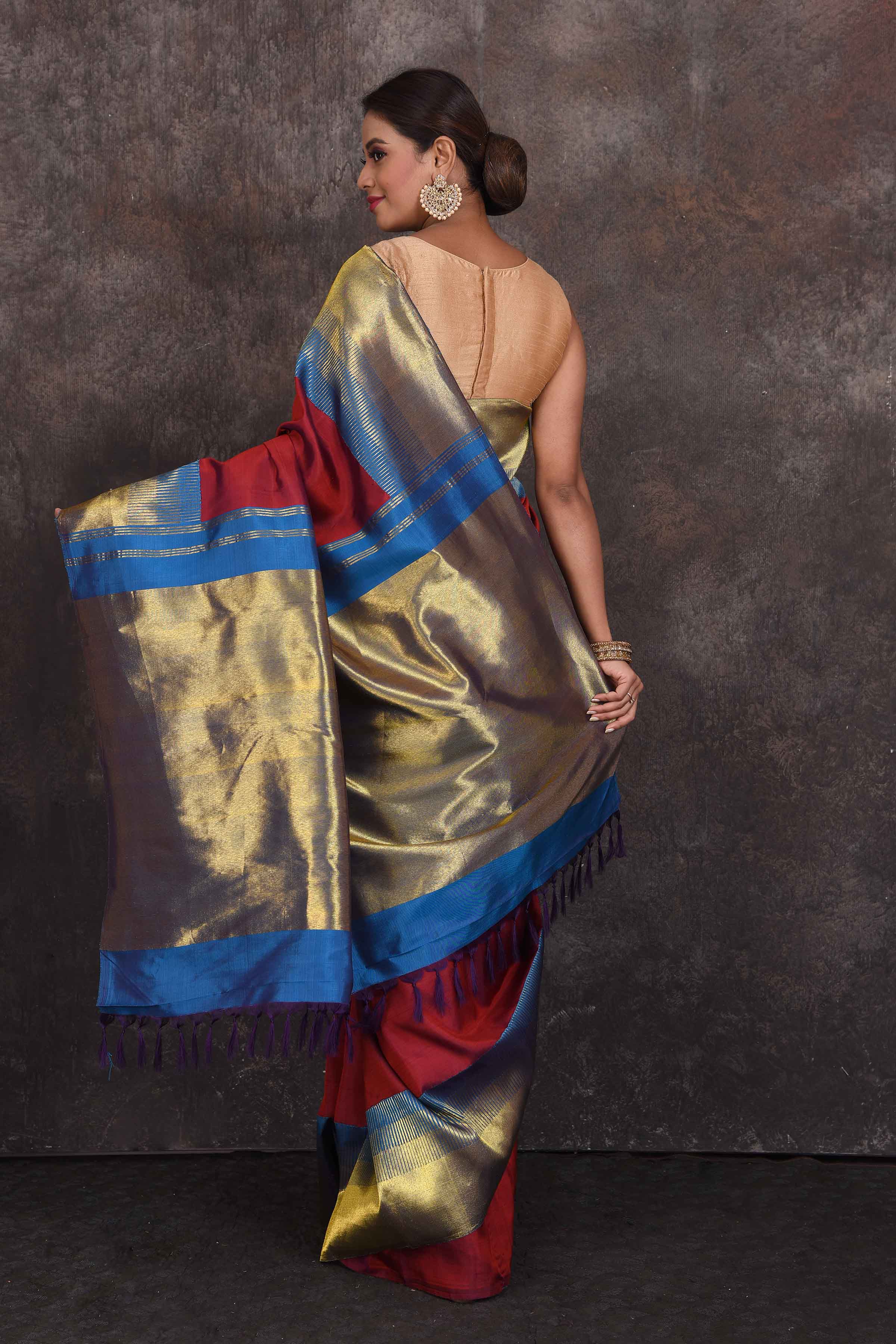 Buy beautiful blood red Kanchipuram silk sari online in USA with blue zari border. Look your best at parties in elegant silk sarees, designer sarees, handwoven sarees, Kanchipuram silk sarees, embroidered sarees, South silk sarees from Pure Elegance Indian saree store in USA.-back