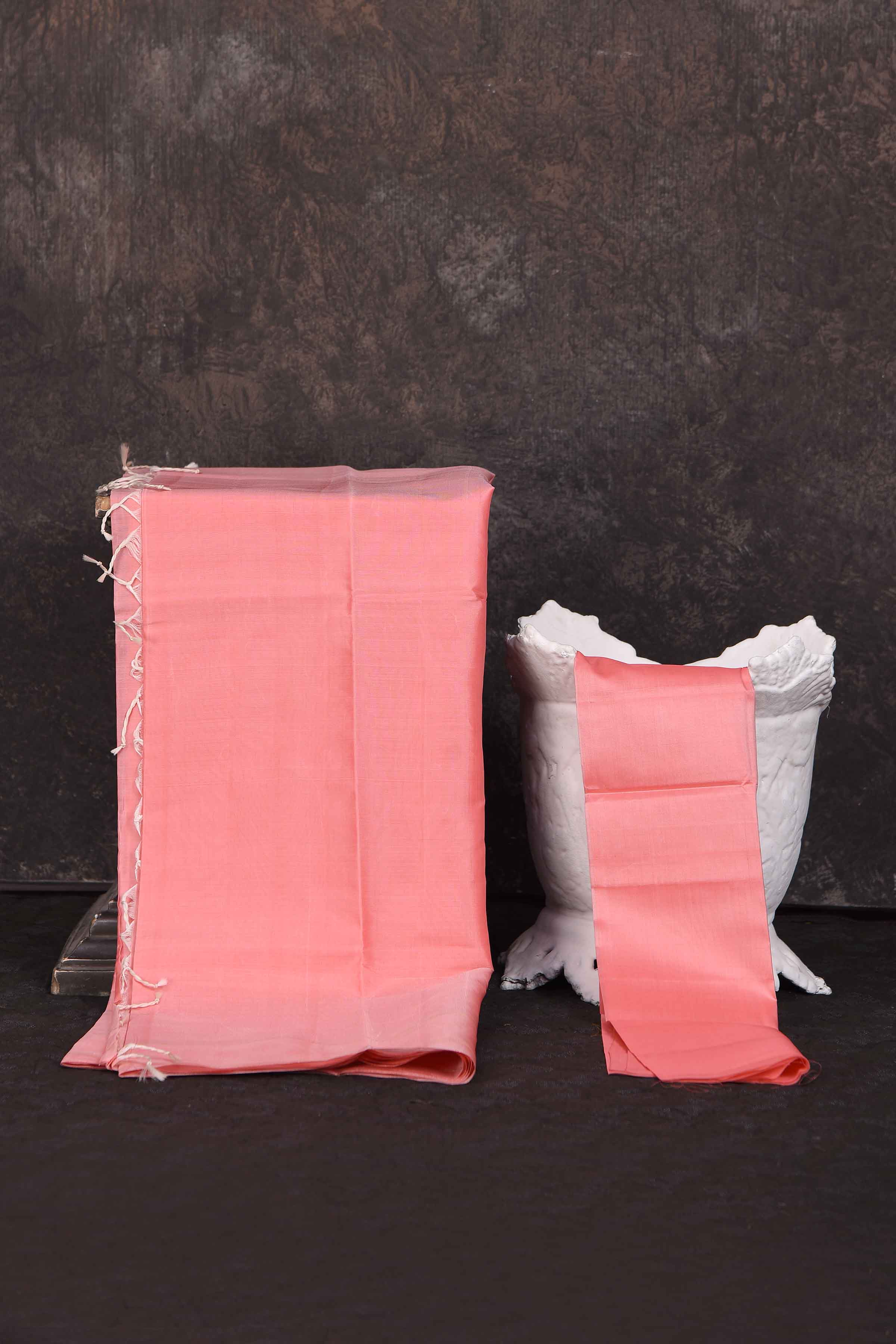 Shop stunning solid baby pink Kanchipuram silk sari online in USA. Look your best at parties in elegant silk sarees, designer sarees, handwoven sarees, Kanchipuram silk sarees, embroidered sarees, South silk sarees from Pure Elegance Indian saree store in USA.-blouse