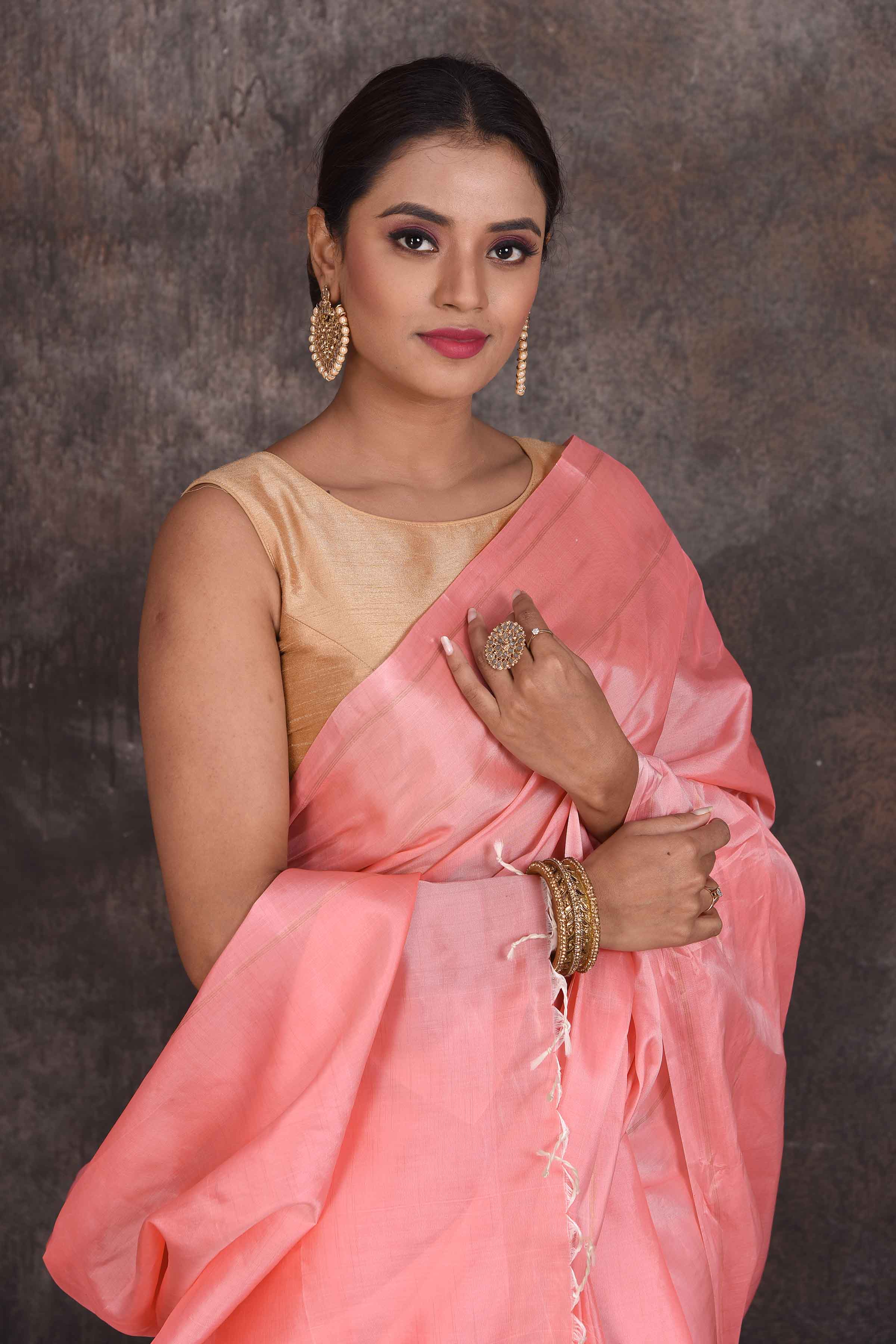 Shop stunning solid baby pink Kanchipuram silk sari online in USA. Look your best at parties in elegant silk sarees, designer sarees, handwoven sarees, Kanchipuram silk sarees, embroidered sarees, South silk sarees from Pure Elegance Indian saree store in USA.-closeup