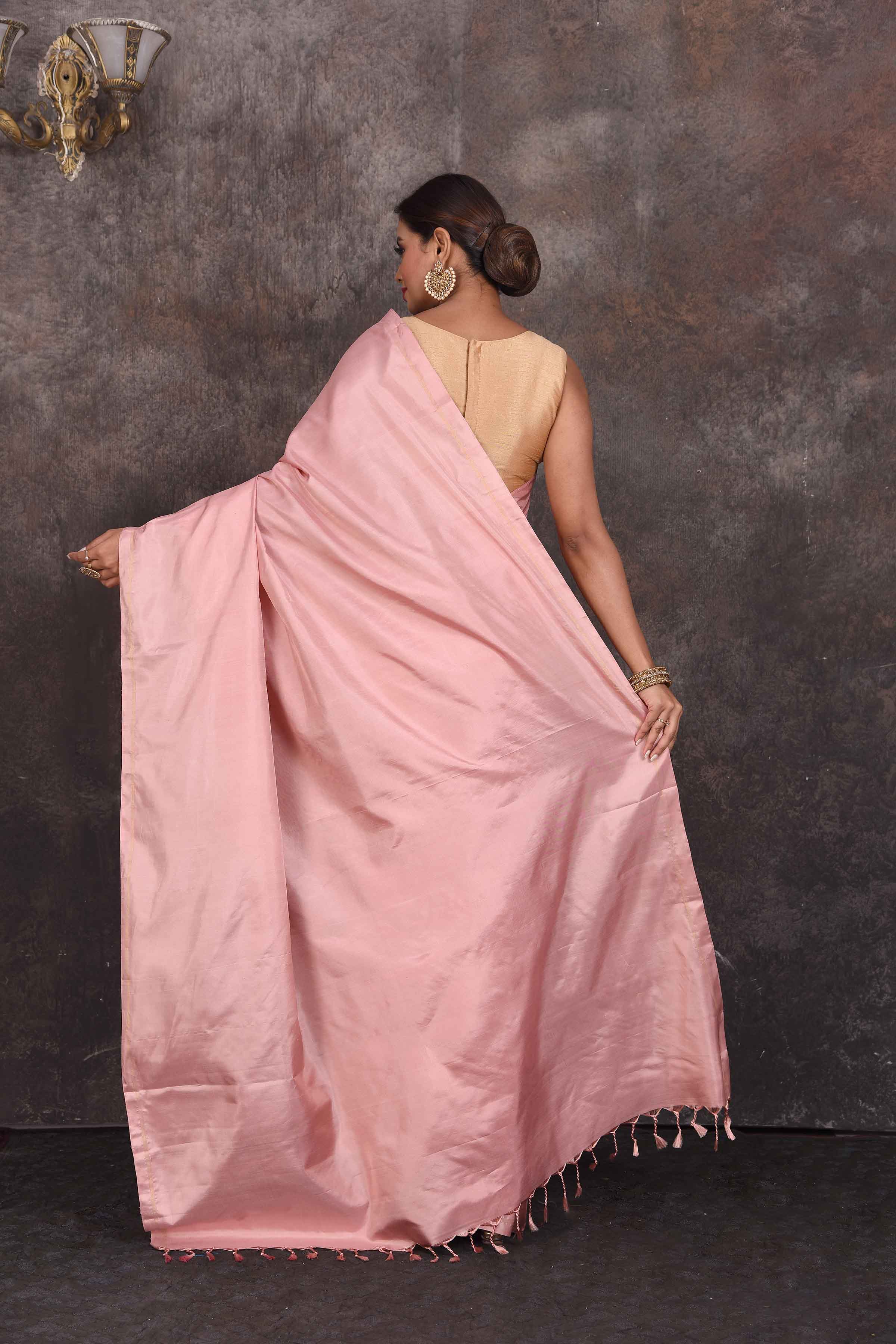Shop stunning solid dusty pink Kanchipuram silk sari online in USA. Look your best at parties in elegant silk sarees, designer sarees, handwoven sarees, Kanchipuram silk sarees, embroidered sarees, South silk sarees from Pure Elegance Indian saree store in USA.-back