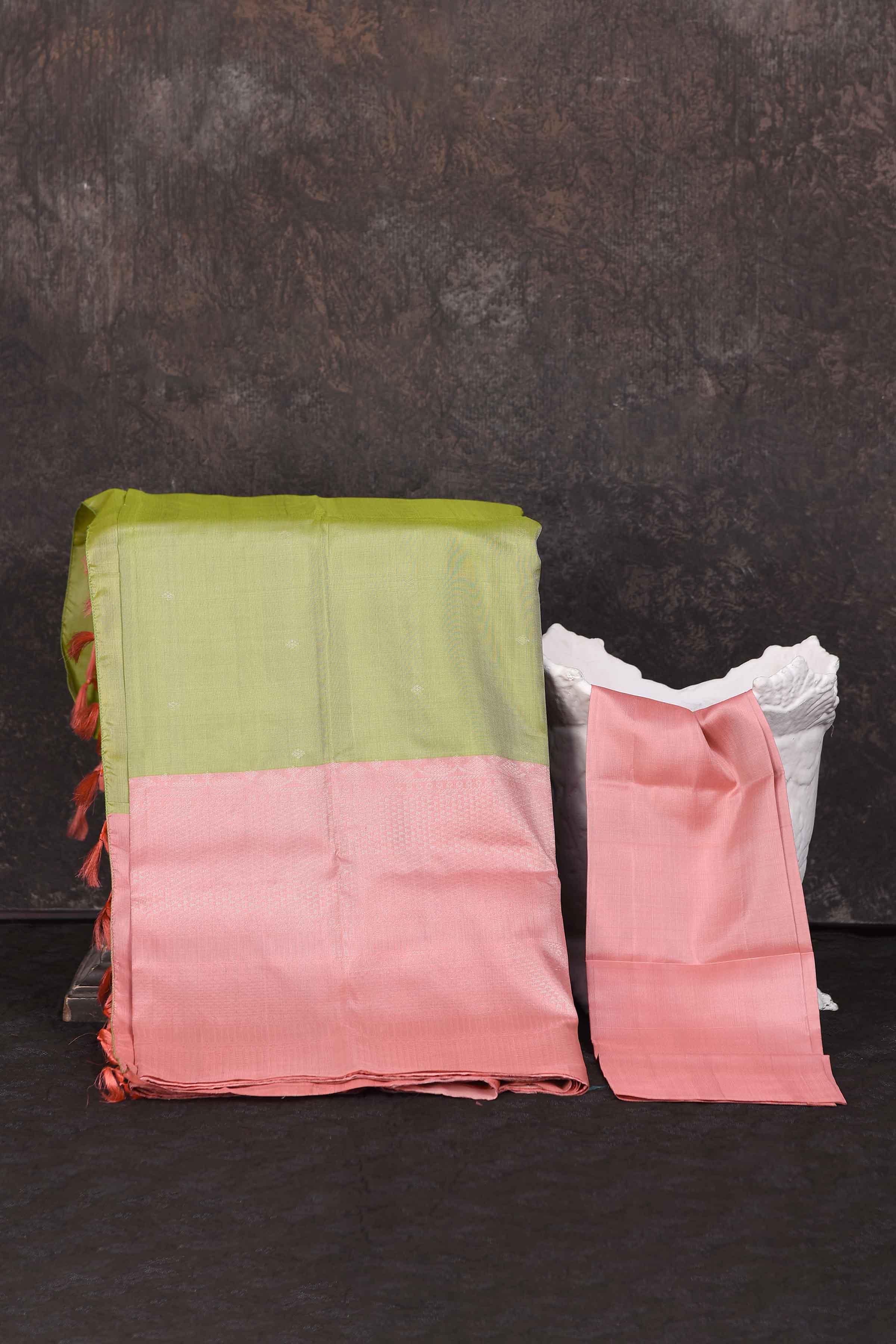 Shop beautiful pista green Kanchipuram silk saree online in USA with pink border. Look your best at parties in elegant silk sarees, designer sarees, handwoven sarees, Kanchipuram silk sarees, embroidered sarees, South silk sarees from Pure Elegance Indian saree store in USA.-blouse