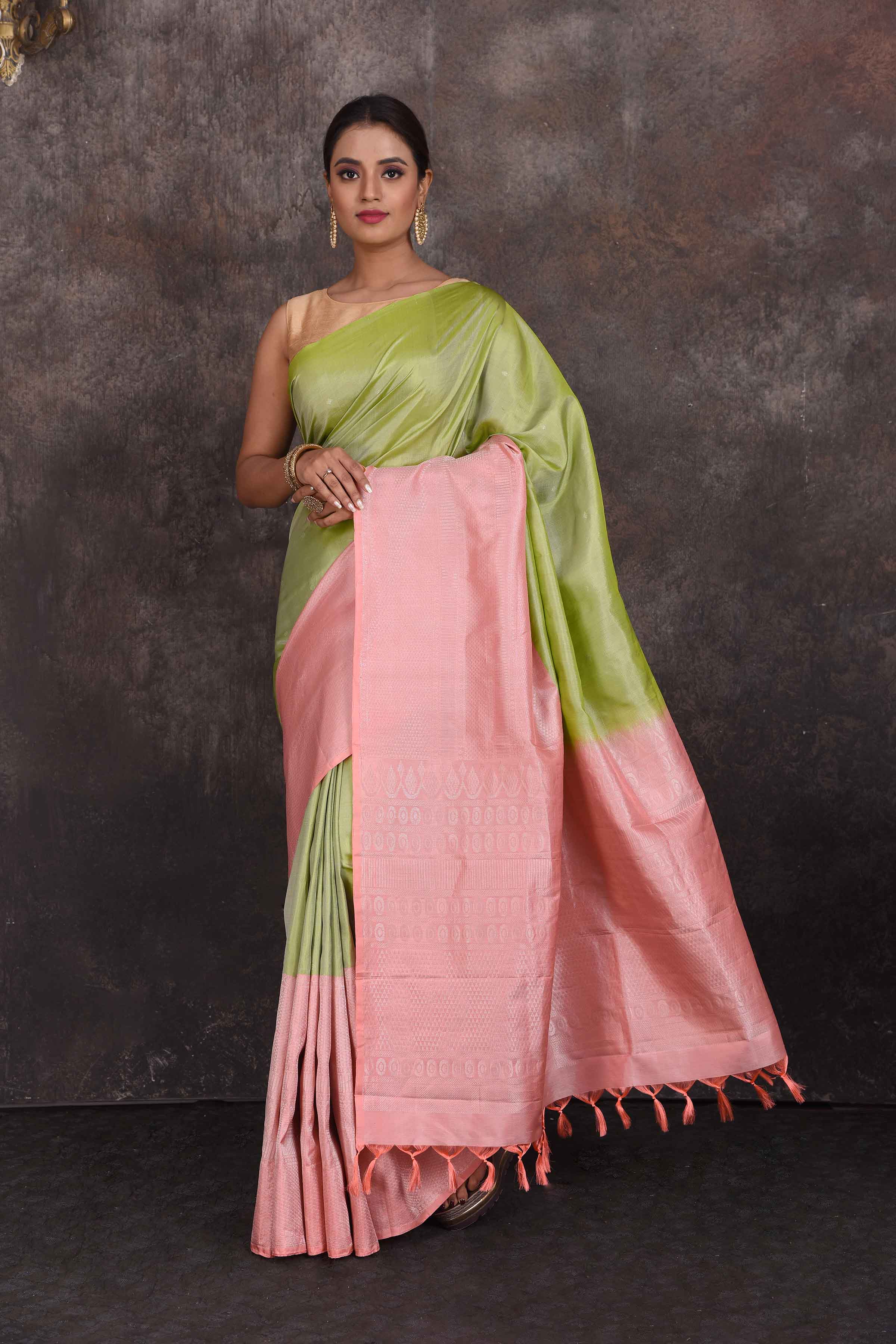 Shop beautiful pista green Kanchipuram silk saree online in USA with pink border. Look your best at parties in elegant silk sarees, designer sarees, handwoven sarees, Kanchipuram silk sarees, embroidered sarees, South silk sarees from Pure Elegance Indian saree store in USA.-full view