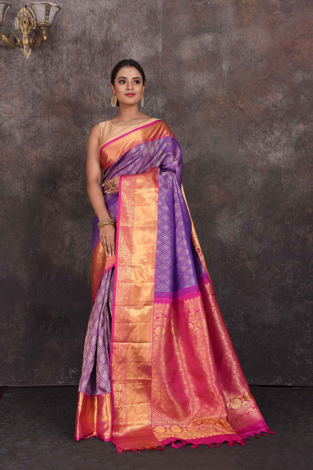 Buy beautiful purple Kanchipuram silk saree online in USA with pink zari border. Look your best at parties in elegant silk sarees, designer sarees, handwoven sarees, Kanchipuram silk sarees, embroidered sarees, South silk sarees from Pure Elegance Indian saree store in USA.-full view