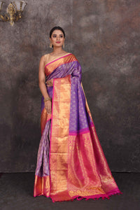 Buy beautiful purple Kanchipuram silk saree online in USA with pink zari border. Look your best at parties in elegant silk sarees, designer sarees, handwoven sarees, Kanchipuram silk sarees, embroidered sarees, South silk sarees from Pure Elegance Indian saree store in USA.-full view