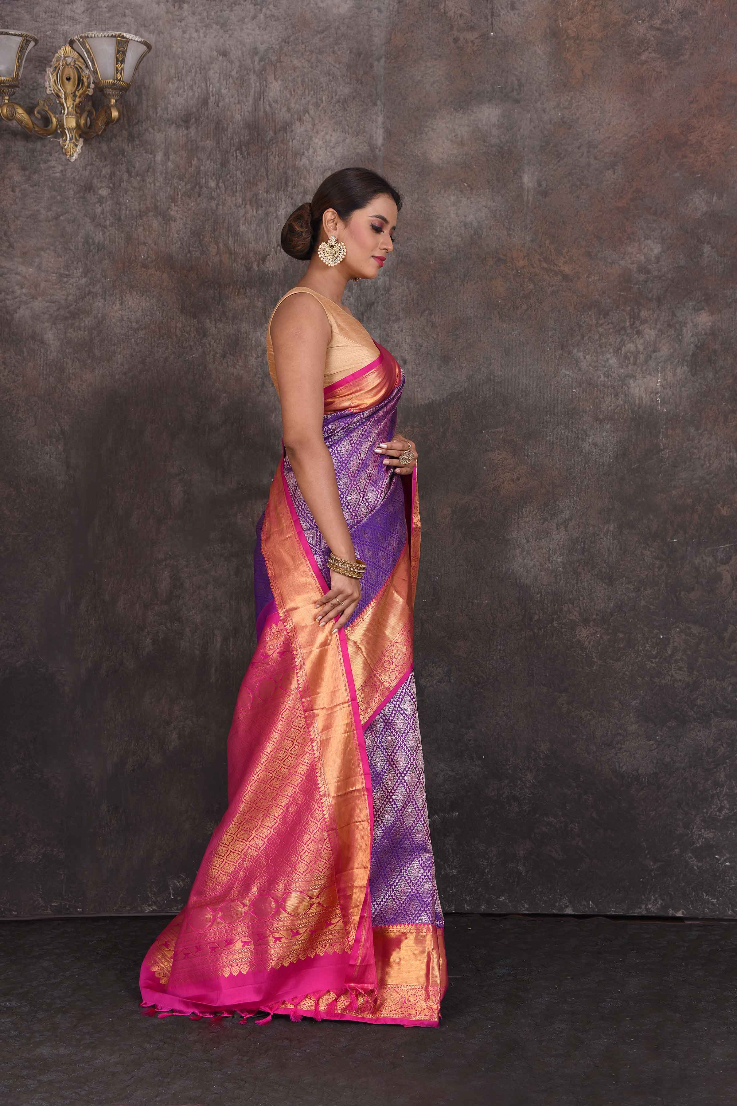 Buy beautiful purple Kanchipuram silk saree online in USA with pink zari border. Look your best at parties in elegant silk sarees, designer sarees, handwoven sarees, Kanchipuram silk sarees, embroidered sarees, South silk sarees from Pure Elegance Indian saree store in USA.-side