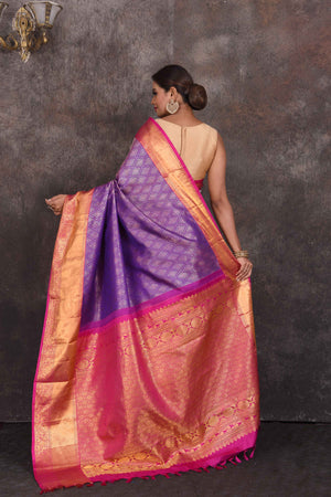 Buy beautiful purple Kanchipuram silk saree online in USA with pink zari border. Look your best at parties in elegant silk sarees, designer sarees, handwoven sarees, Kanchipuram silk sarees, embroidered sarees, South silk sarees from Pure Elegance Indian saree store in USA.-back