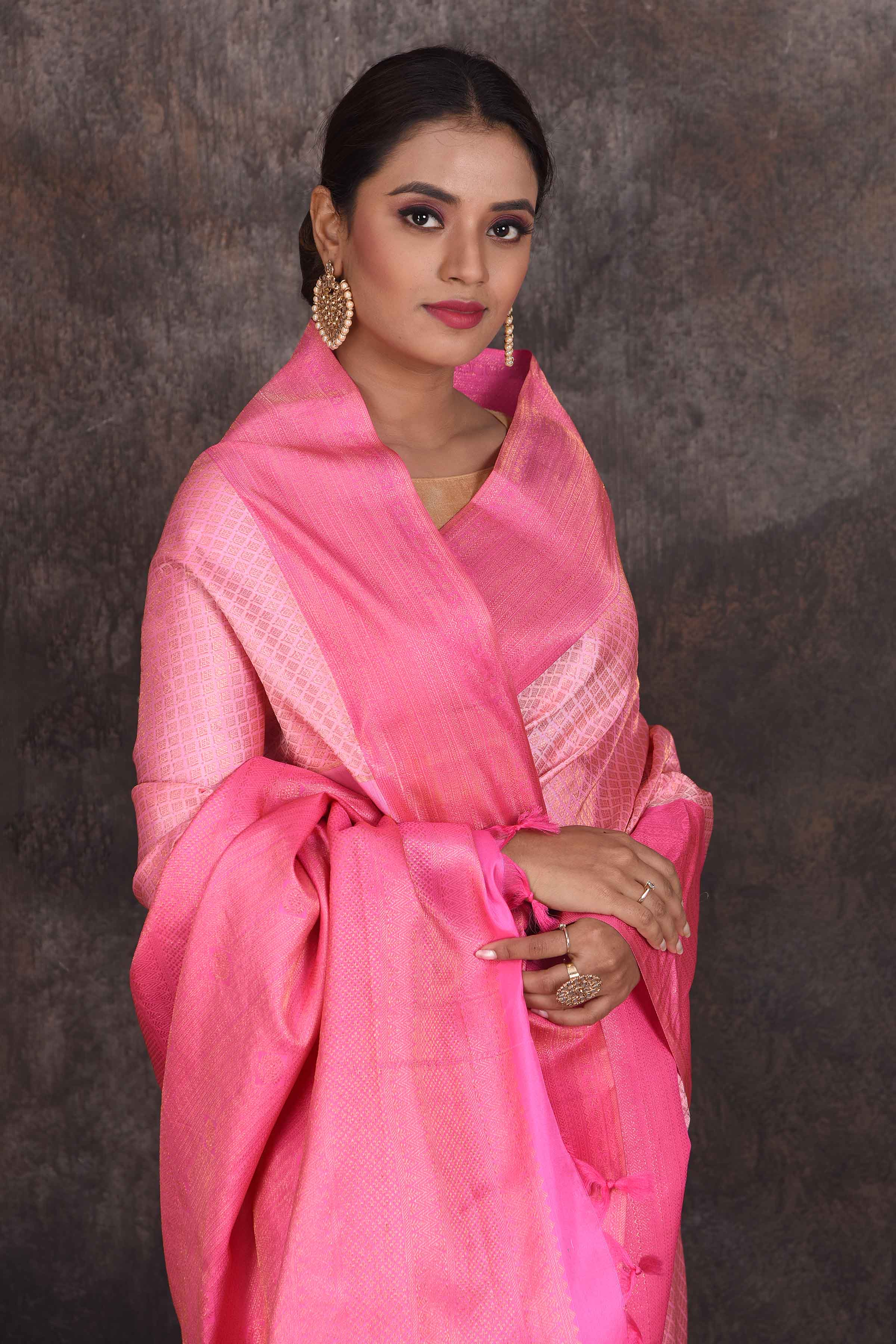 Buy beautiful light pink Kanjivaram silk saree online in USA with dark pink border. Look your best at parties in elegant silk sarees, designer sarees, handwoven sarees, Kanchipuram silk sarees, embroidered sarees, South silk sarees from Pure Elegance Indian saree store in USA.-closeup