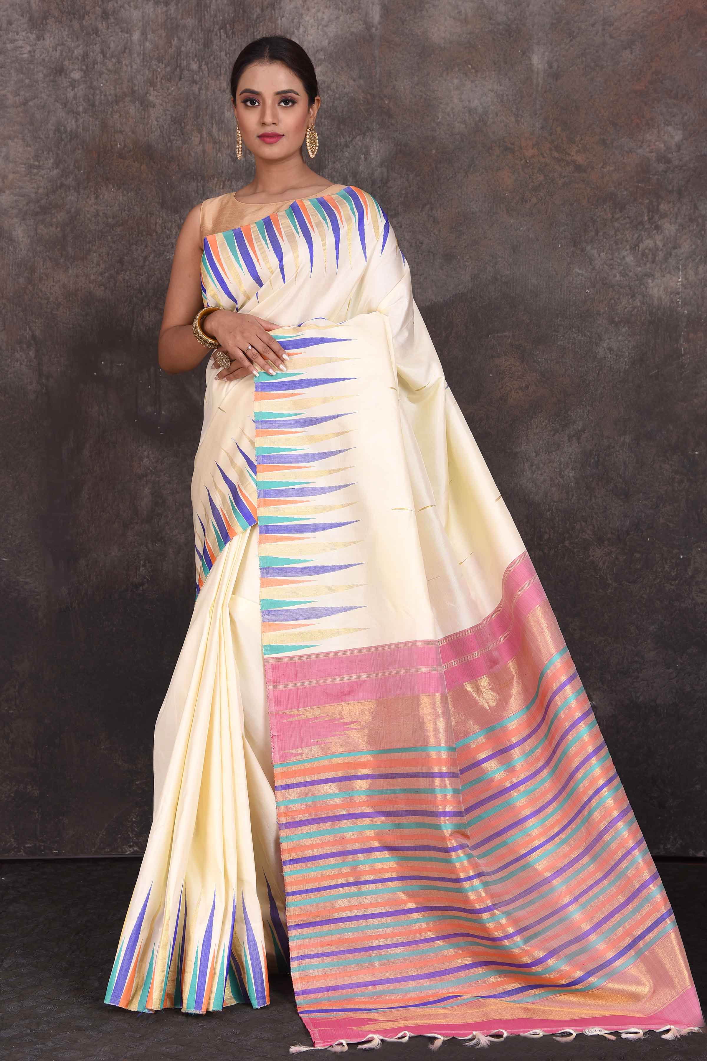 Buy elegant cream Kanjivaram silk saree online in USA with multicolor temple border. Look your best at parties in elegant silk sarees, designer sarees, handwoven sarees, Kanchipuram silk sarees, embroidered sarees, South silk sarees from Pure Elegance Indian saree store in USA.-full view