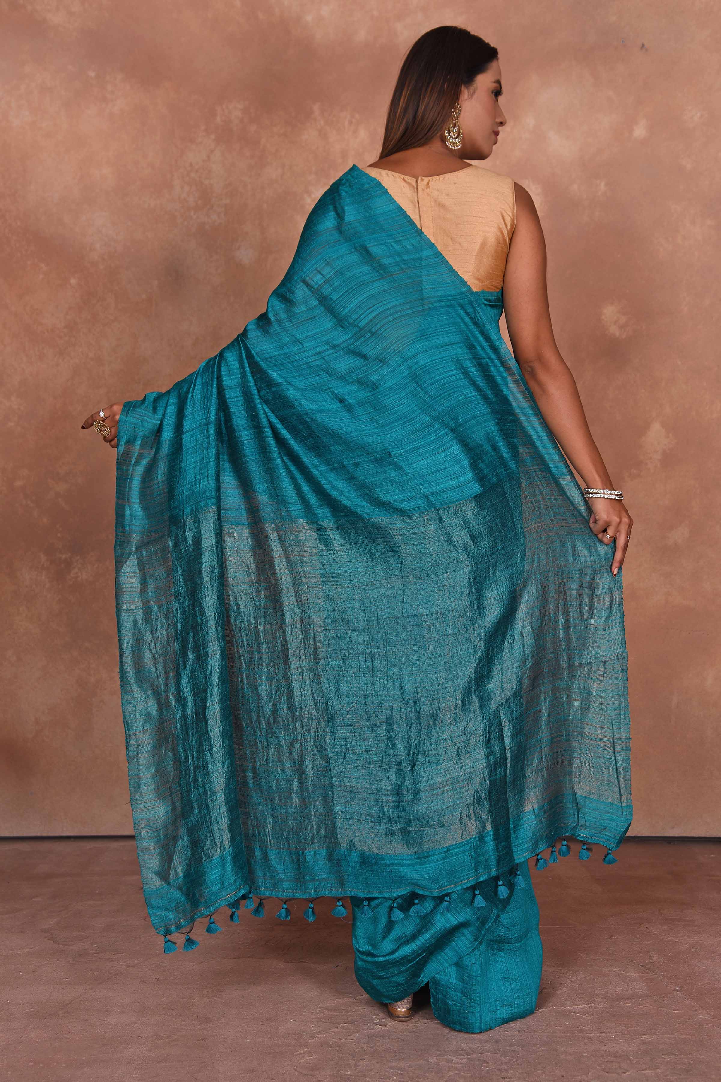 Shop sea blue matka silk sari online in USA with light zari pallu. Keep your ethnic wardrobe up to date with latest designer sarees, pure silk saris, Kanchipuram silk sarees, handwoven sarees, tussar silk saris, embroidered sarees, soft silk sarees from Pure Elegance Indian saree store in USA.-back
