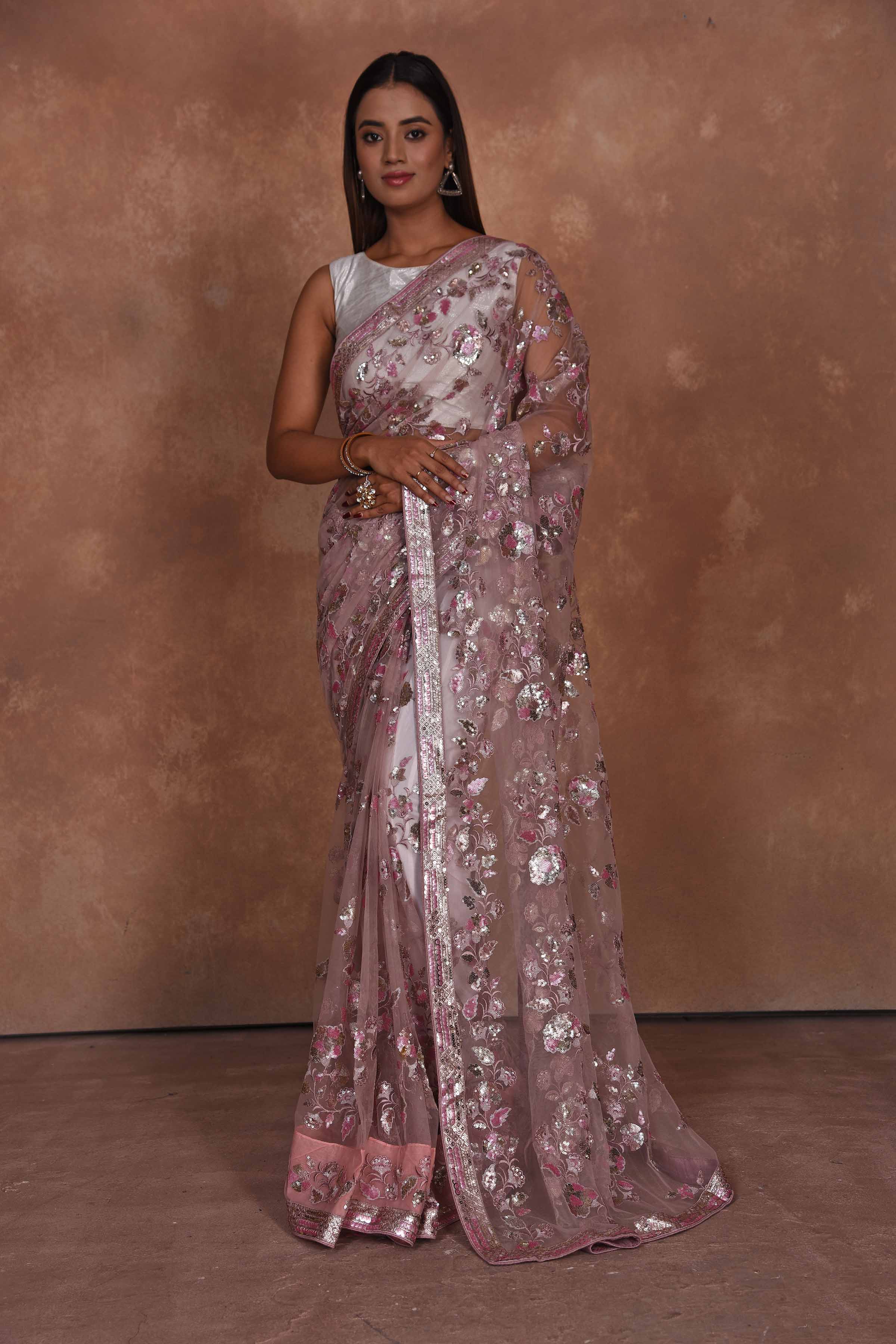 Buy dusty pink heavy embroidery net saree online in USA. Keep your ethnic wardrobe up to date with latest designer sarees, pure silk saris, Kanchipuram silk sarees, handwoven sarees, tussar silk saris, embroidered sarees, soft silk sarees from Pure Elegance Indian saree store in USA.-full view