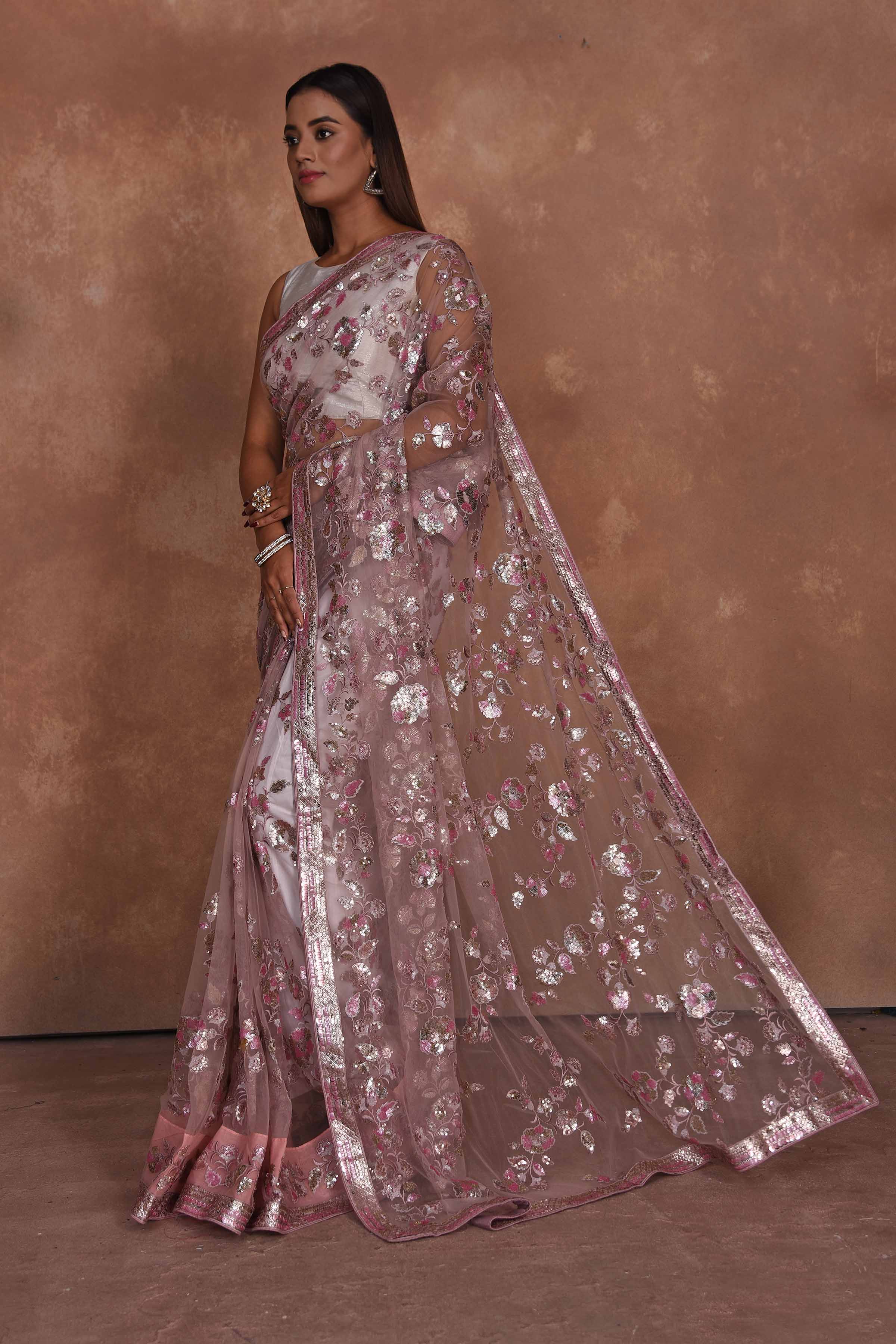 Buy dusty pink heavy embroidery net saree online in USA. Keep your ethnic wardrobe up to date with latest designer sarees, pure silk saris, Kanchipuram silk sarees, handwoven sarees, tussar silk saris, embroidered sarees, soft silk sarees from Pure Elegance Indian saree store in USA.-pallu
