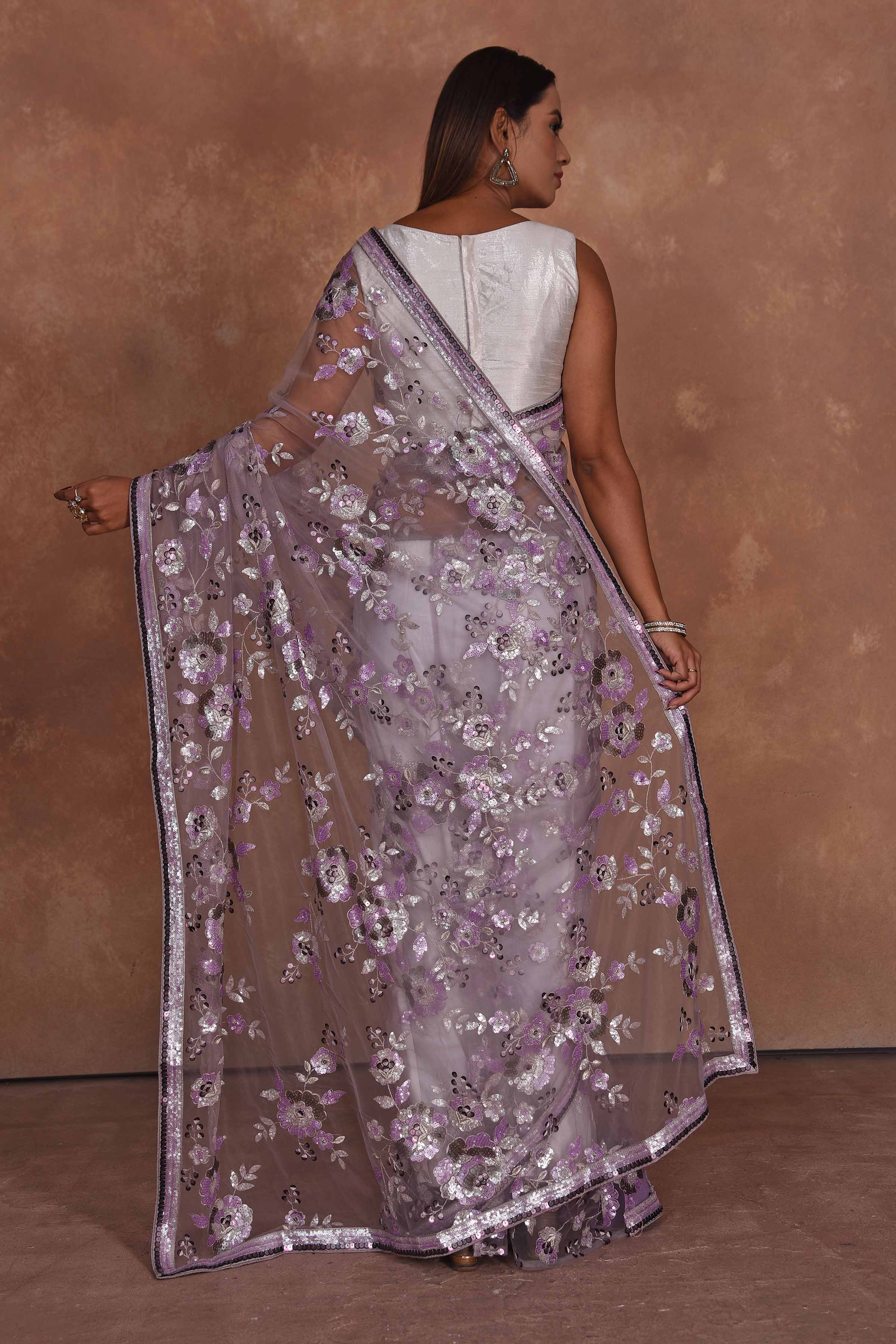 Shop lavender heavy embroidery net saree online in USA. Keep your ethnic wardrobe up to date with latest designer sarees, pure silk saris, Kanchipuram silk sarees, handwoven sarees, tussar silk saris, embroidered sarees, soft silk sarees from Pure Elegance Indian saree store in USA.-back