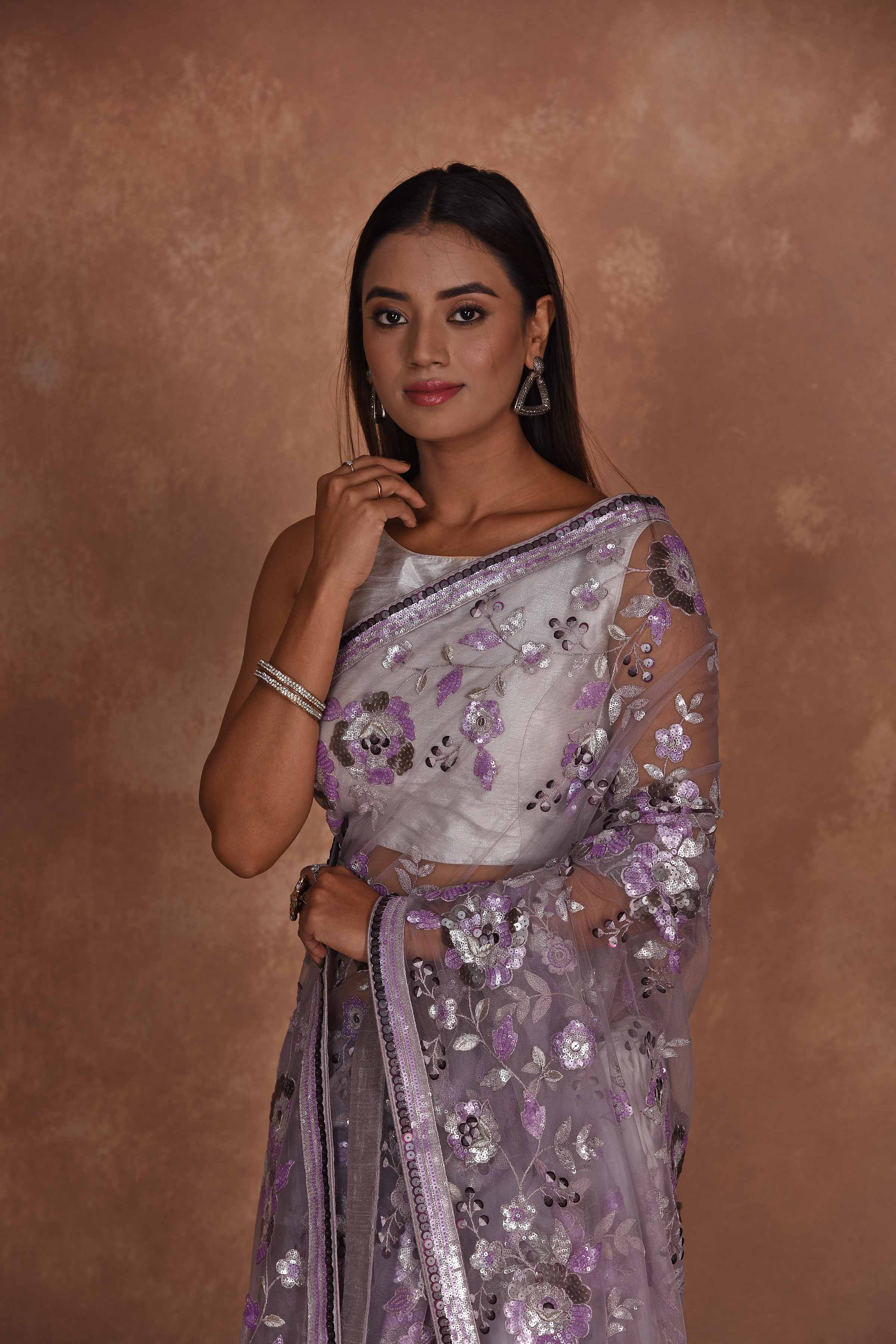 Shop lavender heavy embroidery net saree online in USA. Keep your ethnic wardrobe up to date with latest designer sarees, pure silk saris, Kanchipuram silk sarees, handwoven sarees, tussar silk saris, embroidered sarees, soft silk sarees from Pure Elegance Indian saree store in USA.-closeup